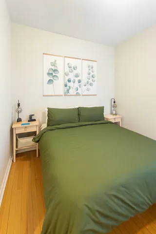 a living room with a table and a potted plant