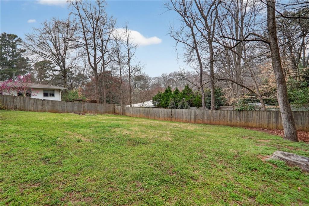 1127 Moores Mill Road Northwest Atlanta, GA 30327 - Photo 3 of 20 a view of a yard with a house