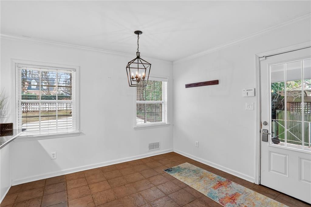 1127 Moores Mill Road Northwest Atlanta, GA 30327 - Photo 10 of 20 a view of an empty room with windows
