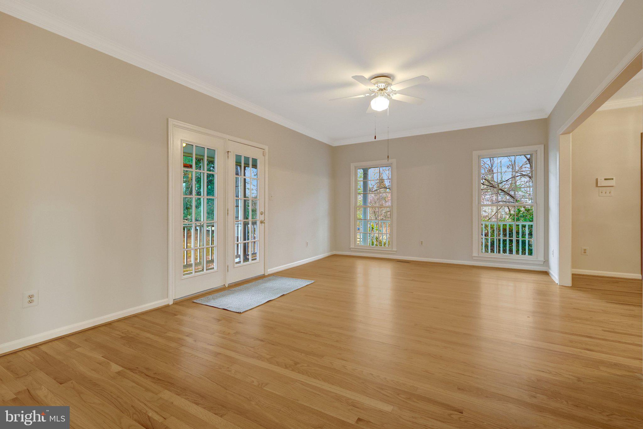 11273 Waples Mill Road Oakton, VA 22124 - Photo 34 of 75 a view of an empty room with wooden floor and a window
