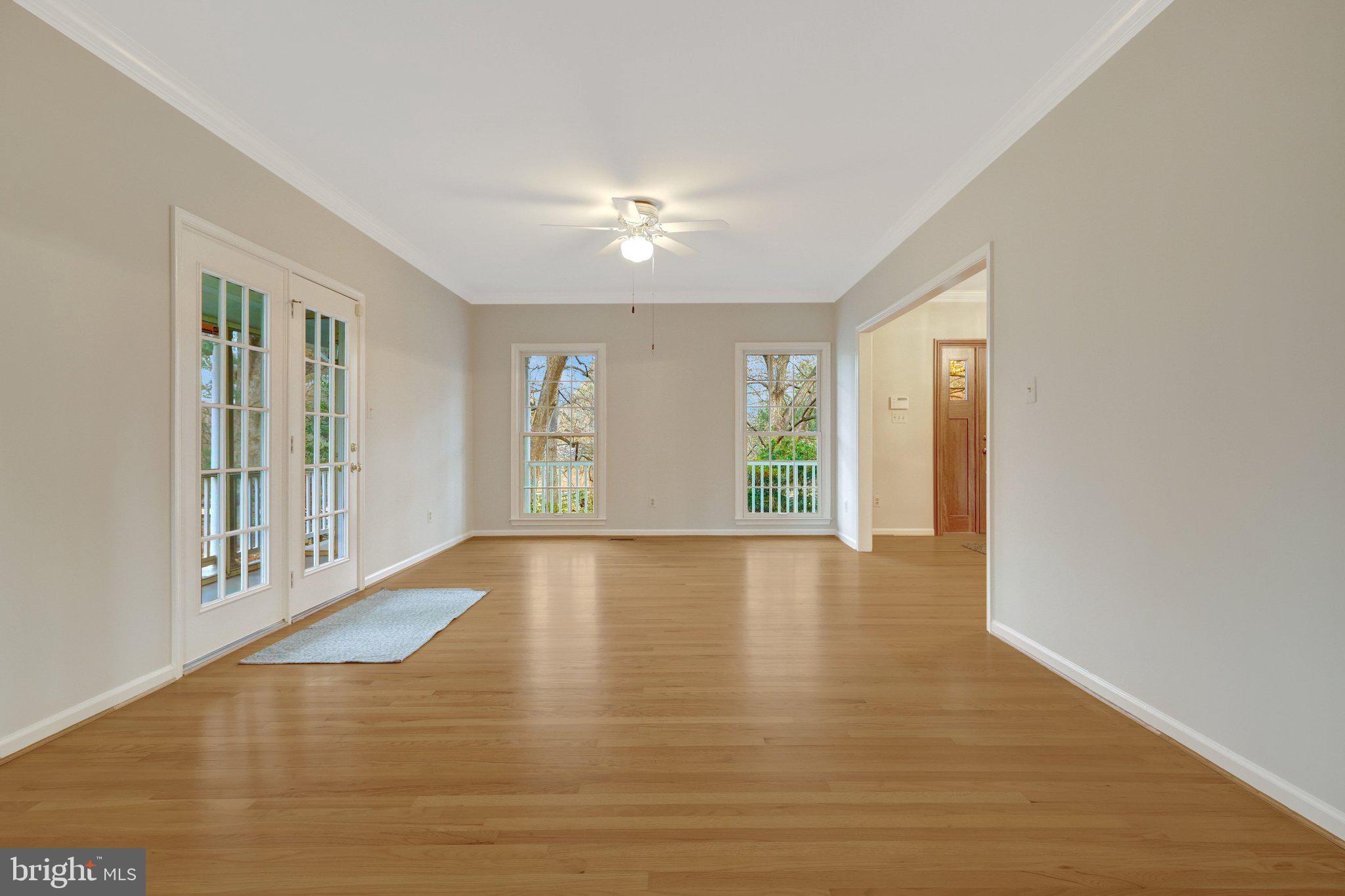 11273 Waples Mill Road Oakton, VA 22124 - Photo 35 of 75 a view of an empty room with glass door and balcony