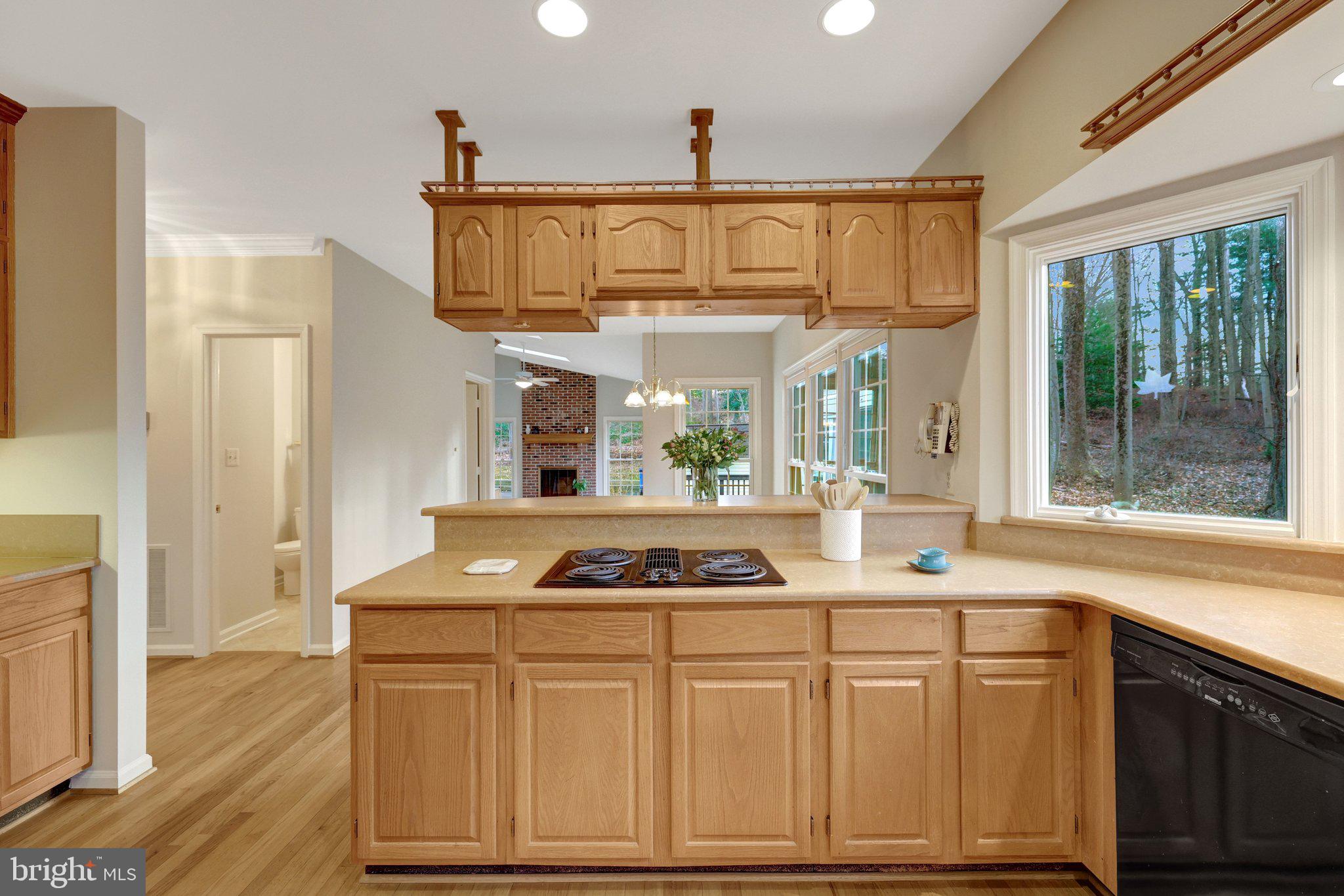 11273 Waples Mill Road Oakton, VA 22124 - Photo 43 of 75 a kitchen with stainless steel appliances granite countertop a stove a sink dishwasher and cabinets with wooden floor