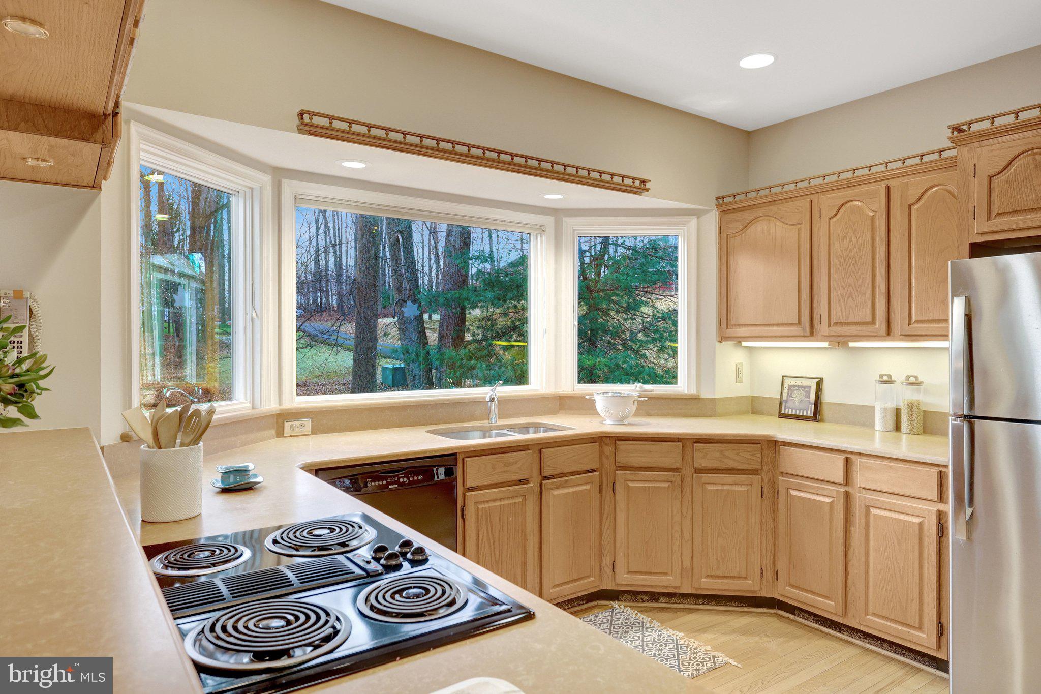 11273 Waples Mill Road Oakton, VA 22124 - Photo 44 of 75 a kitchen with a sink stove and refrigerator