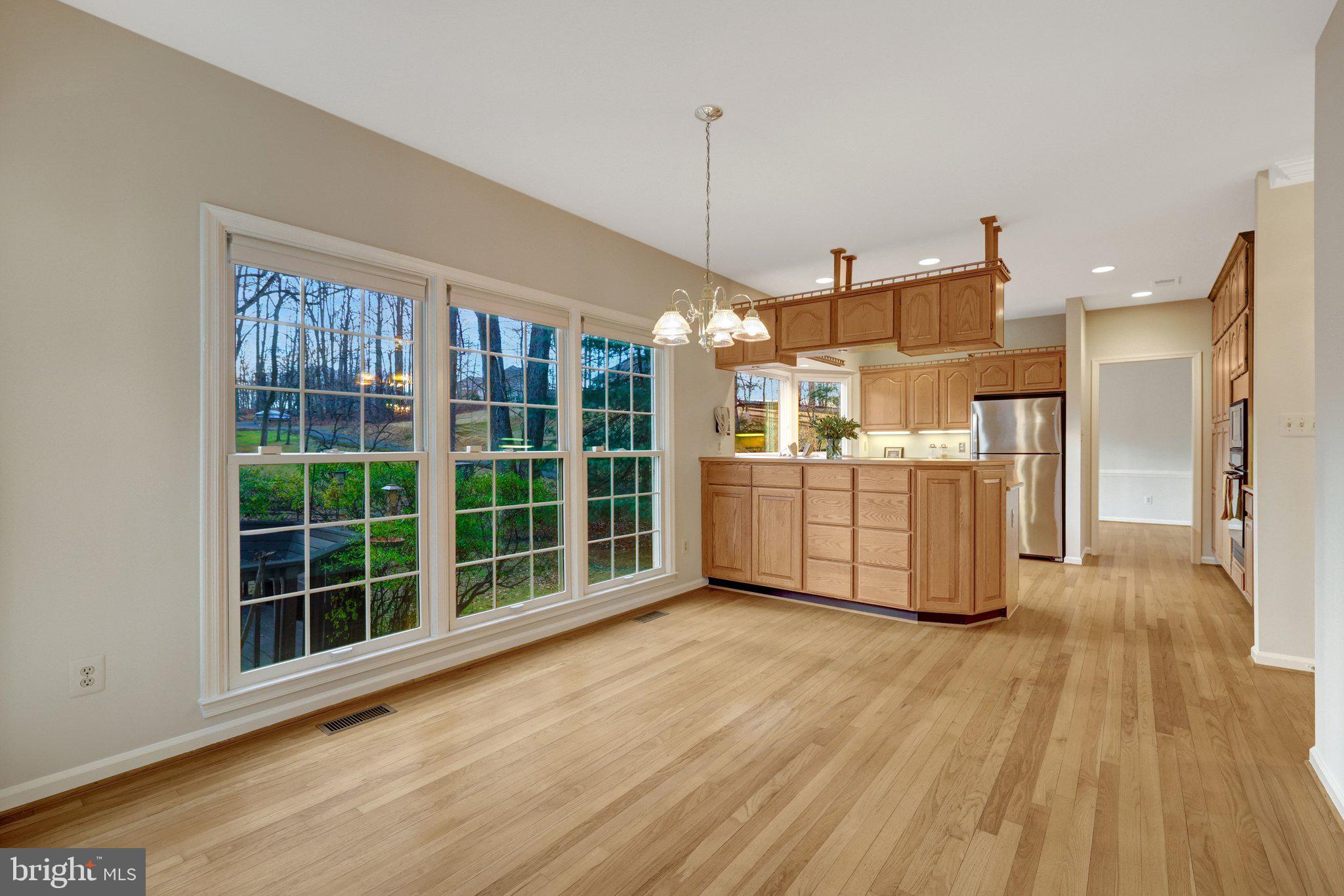 11273 Waples Mill Road Oakton, VA 22124 - Photo 46 of 75 a view of a kitchen with wooden floor and windows