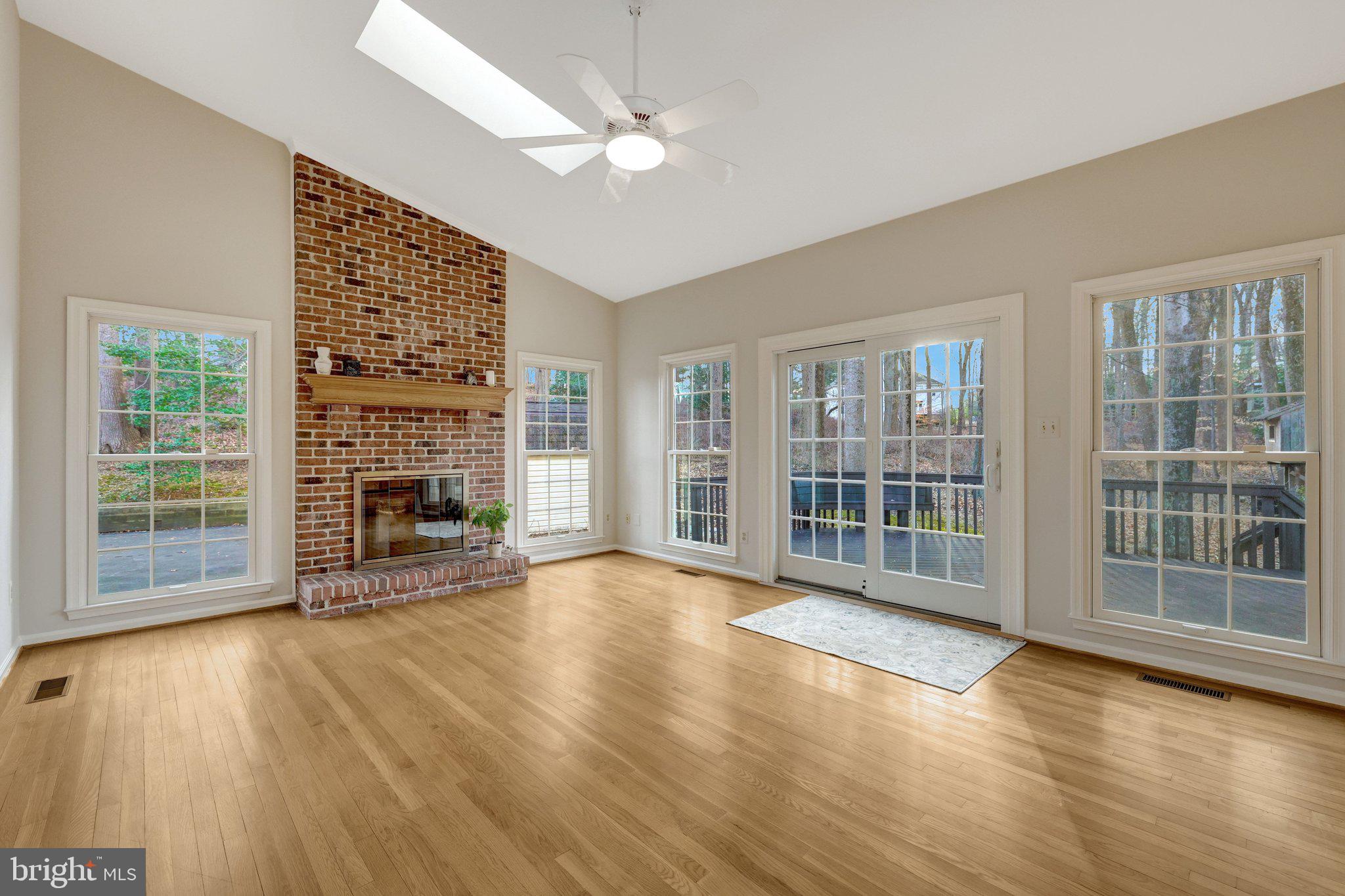 11273 Waples Mill Road Oakton, VA 22124 - Photo 48 of 75 a view of empty room with wooden floor and fireplace