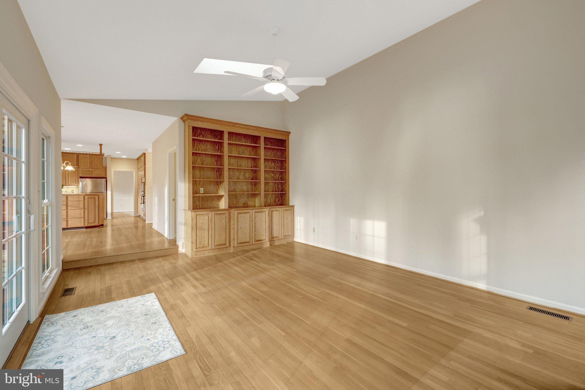 11273 Waples Mill Road Oakton, VA 22124 - Photo 49 of 75 an empty room with wooden floor and windows