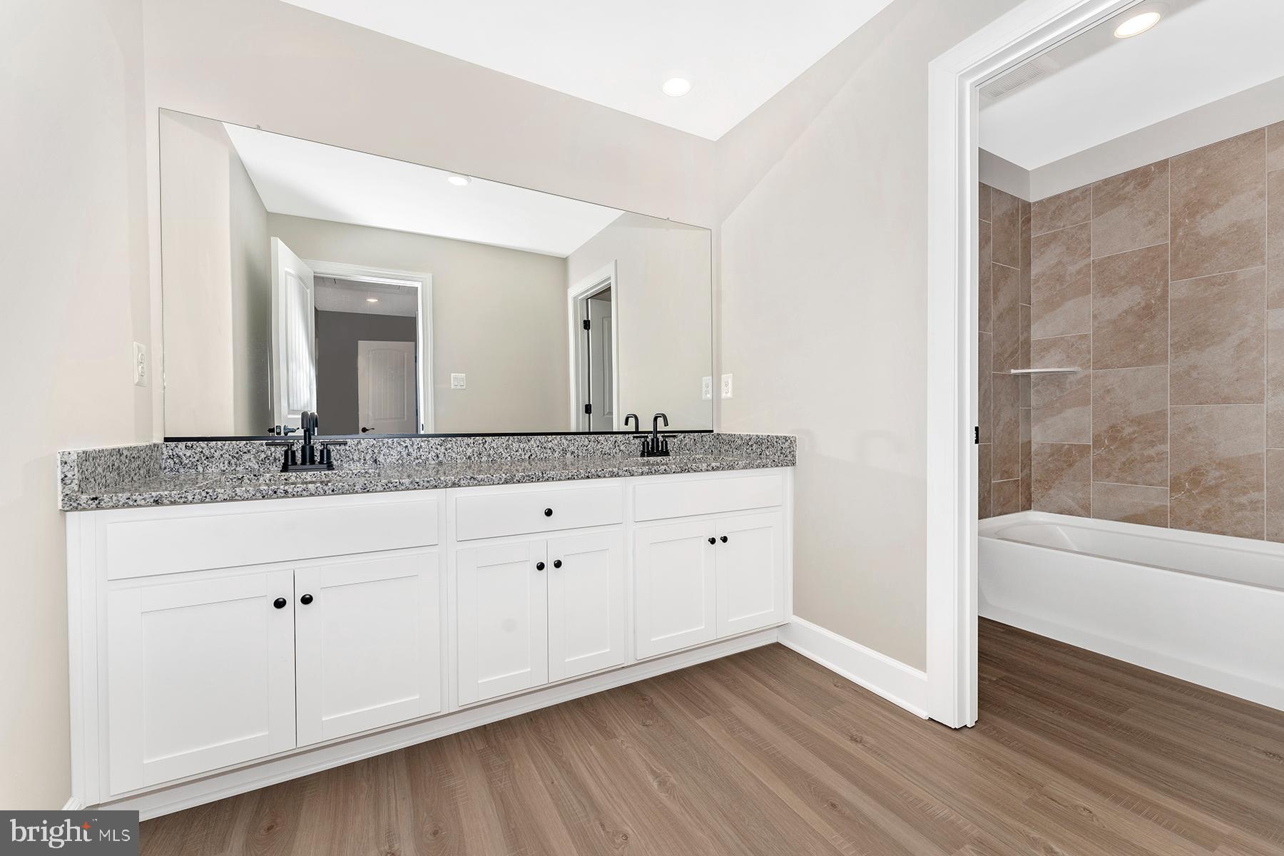 508 Abigail Avenue Waynesboro, PA 17268 - Photo 23 of 23 a bathroom with a granite countertop sink and a mirror