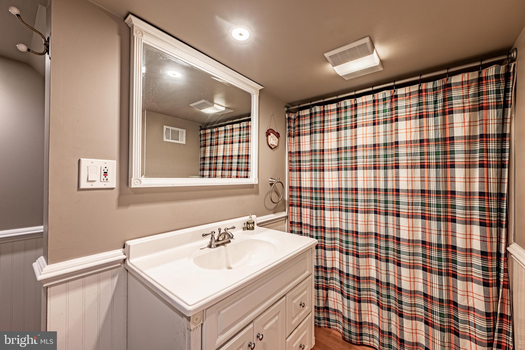211 East Wheel Road Abingdon, MD 21009 - Photo 21 of 27 a bathroom with a sink toilet and shower