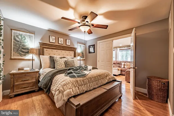 a bed room with a bed and a chandelier