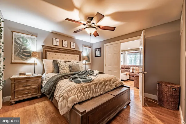 a bed room with a bed and a chandelier