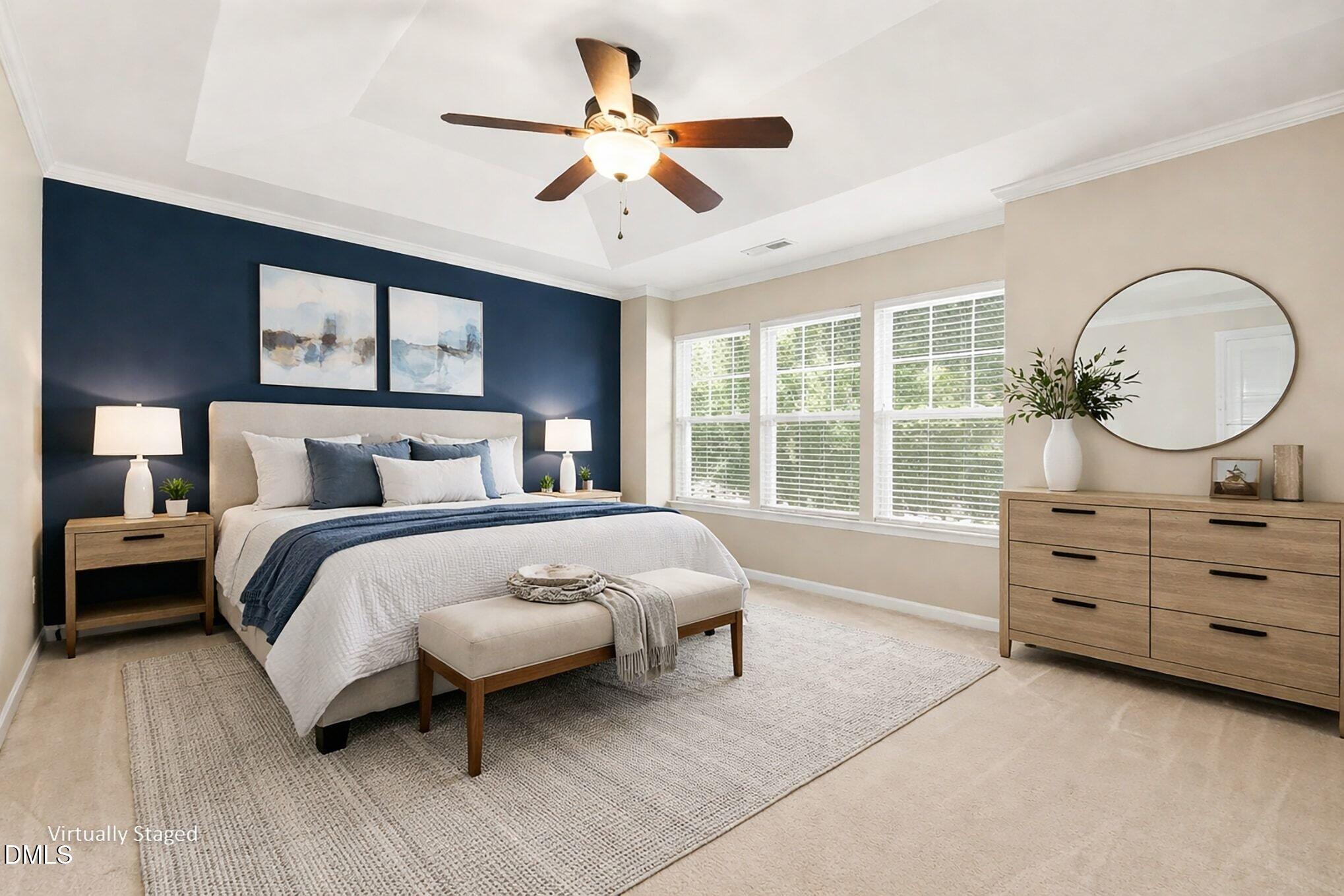 2409 Memory Ridge Drive Raleigh, NC 27606 - Photo 16 of 36 a bedroom with a bed a window and a chandelier