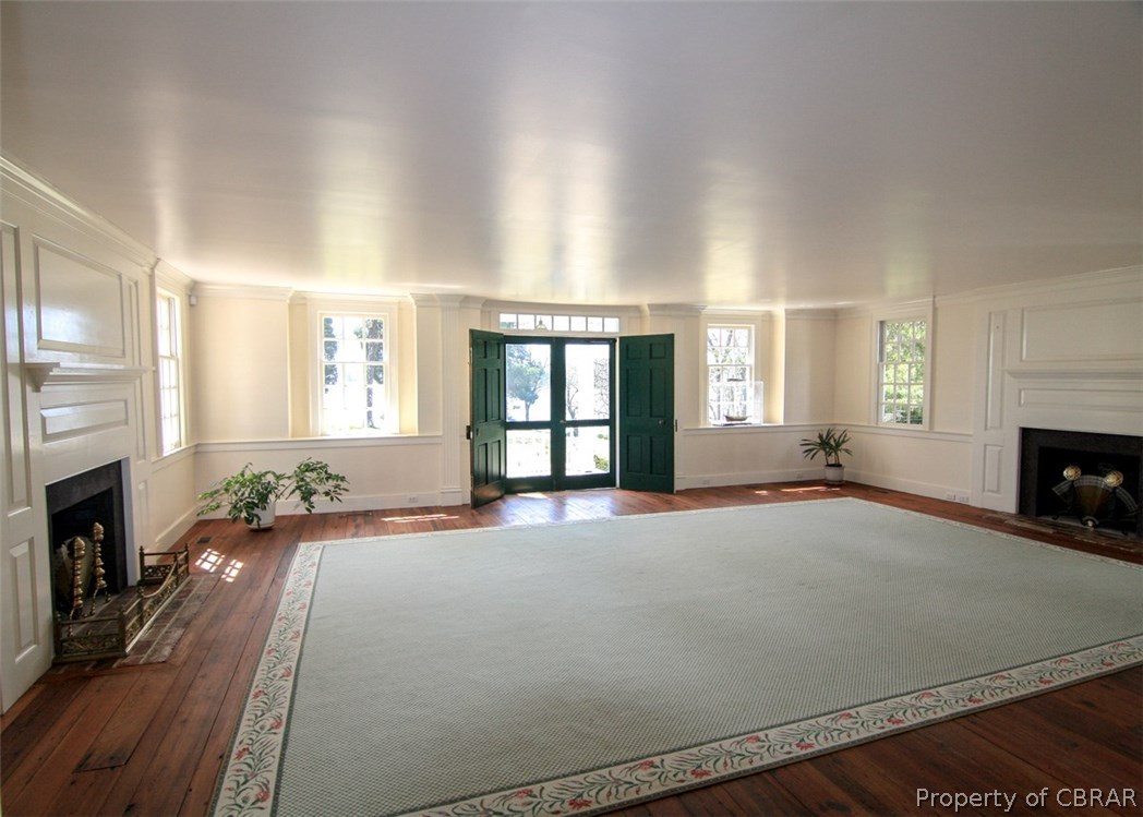 4553 Merry Point Road Lancaster, VA 22503 - Photo 19 of 41 Absolutely charming formal living room with fireplaces and double door overlooking River.
