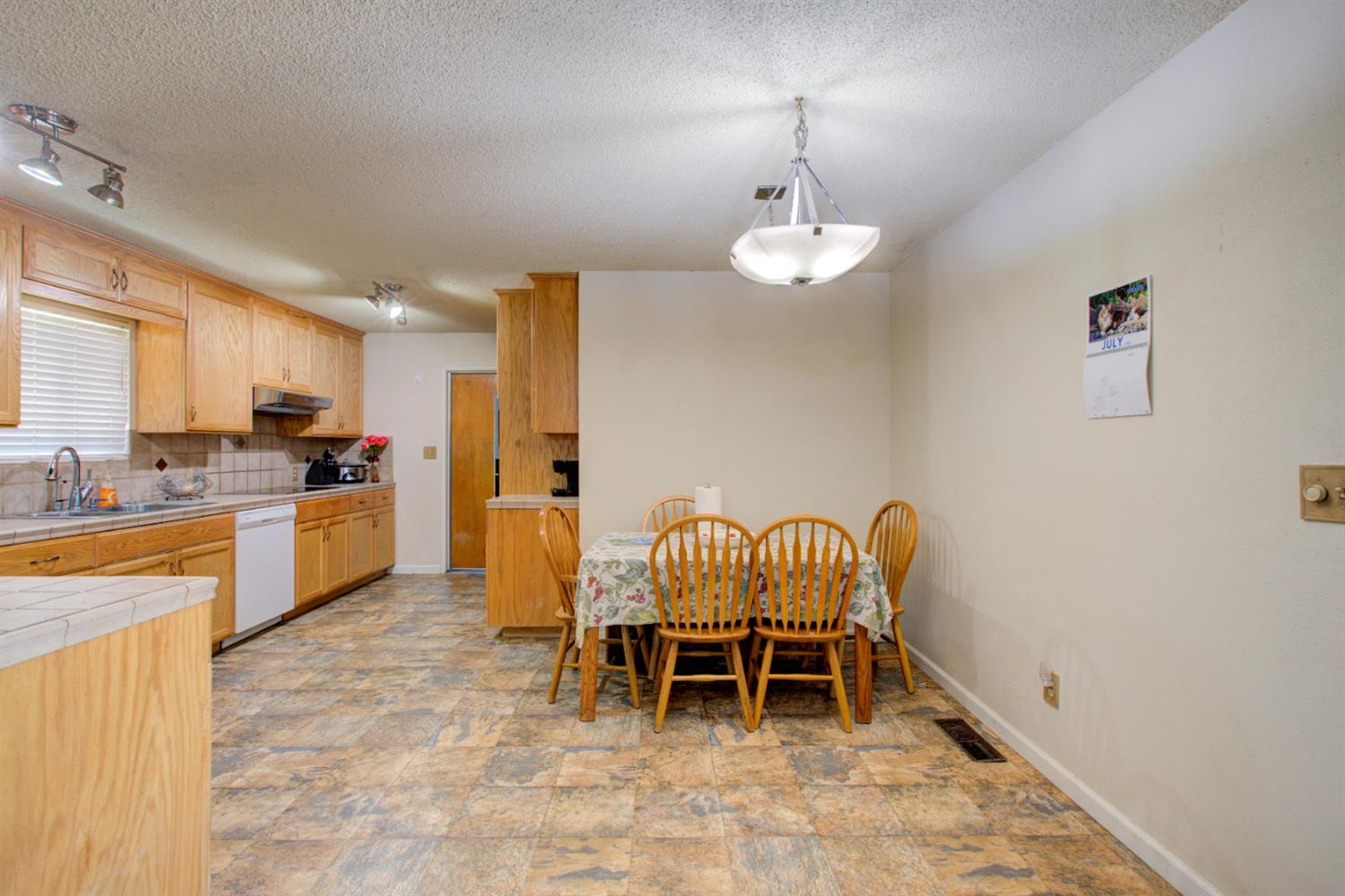 2982 Sequoia Drive Merced, CA 95340 - Photo 11 of 33 a dining room with furniture and chandelier