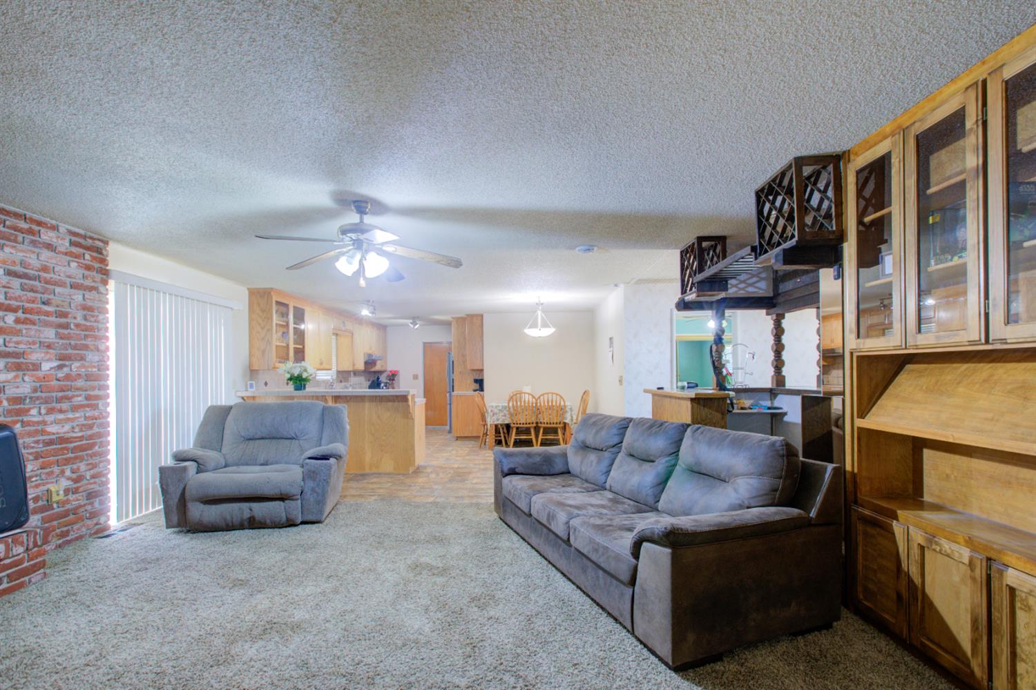 2982 Sequoia Drive Merced, CA 95340 - Photo 14 of 33 a living room with furniture and a fireplace