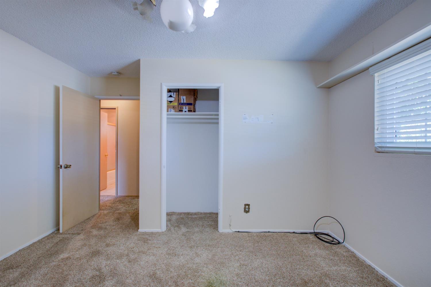 2982 Sequoia Drive Merced, CA 95340 - Photo 20 of 33 an empty room with windows and closet