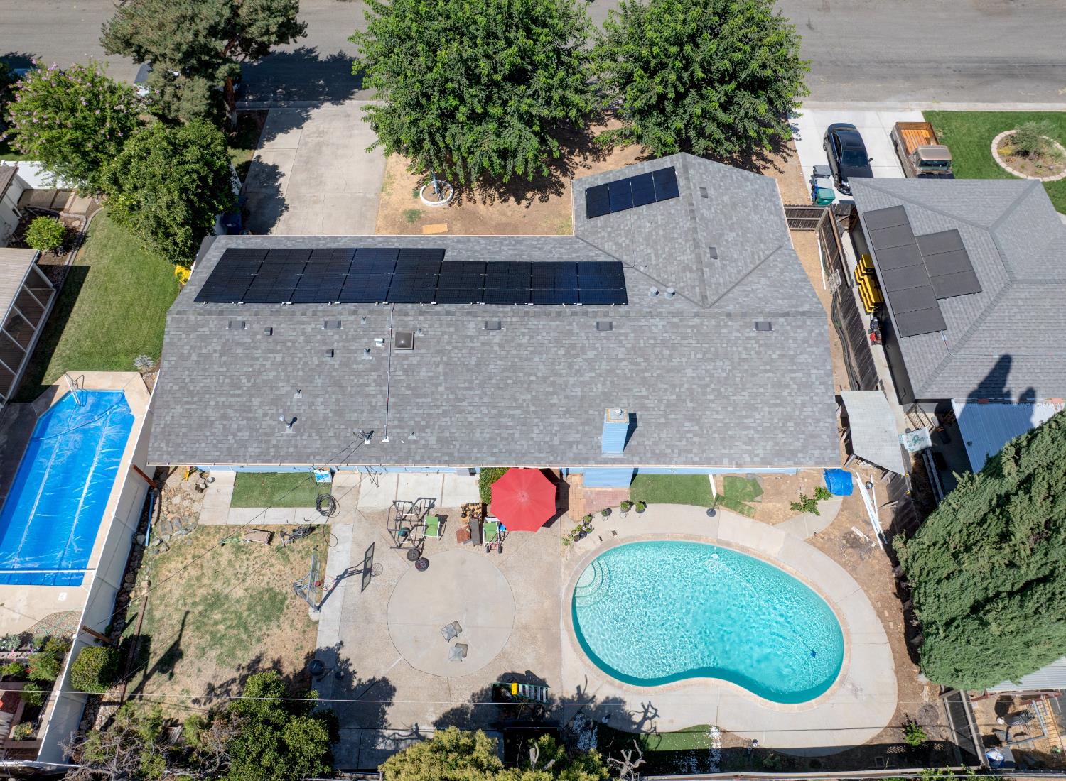 2982 Sequoia Drive Merced, CA 95340 - Photo 2 of 33 an aerial view of a house with swimming pool and a yard