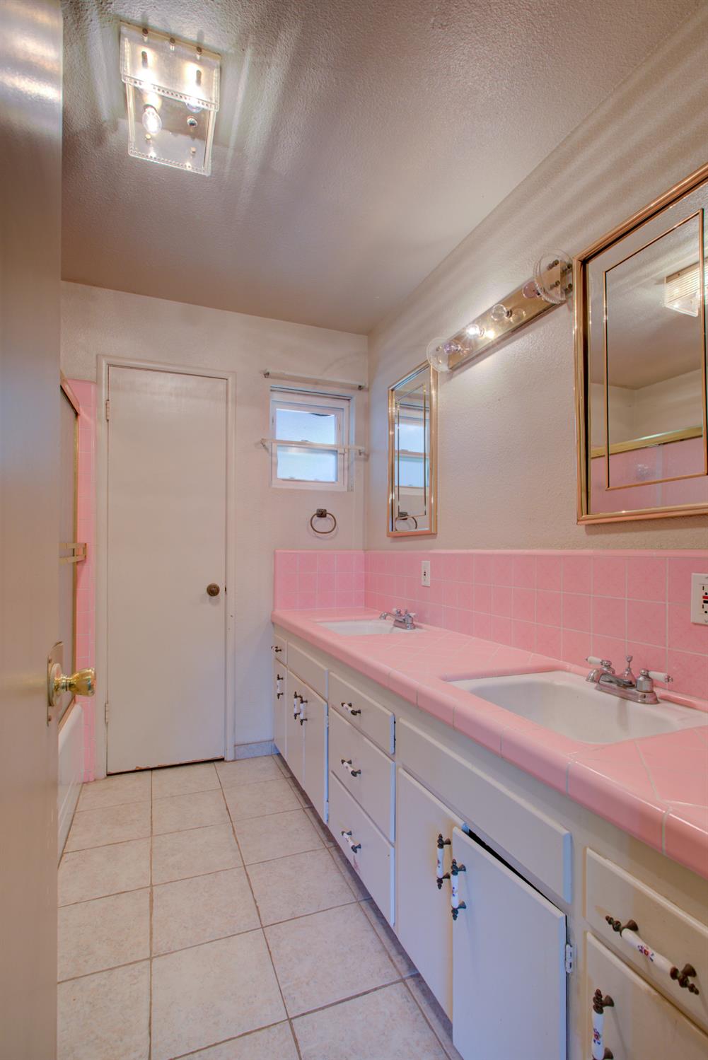 2982 Sequoia Drive Merced, CA 95340 - Photo 26 of 33 a bathroom with a sink a mirror and a shower
