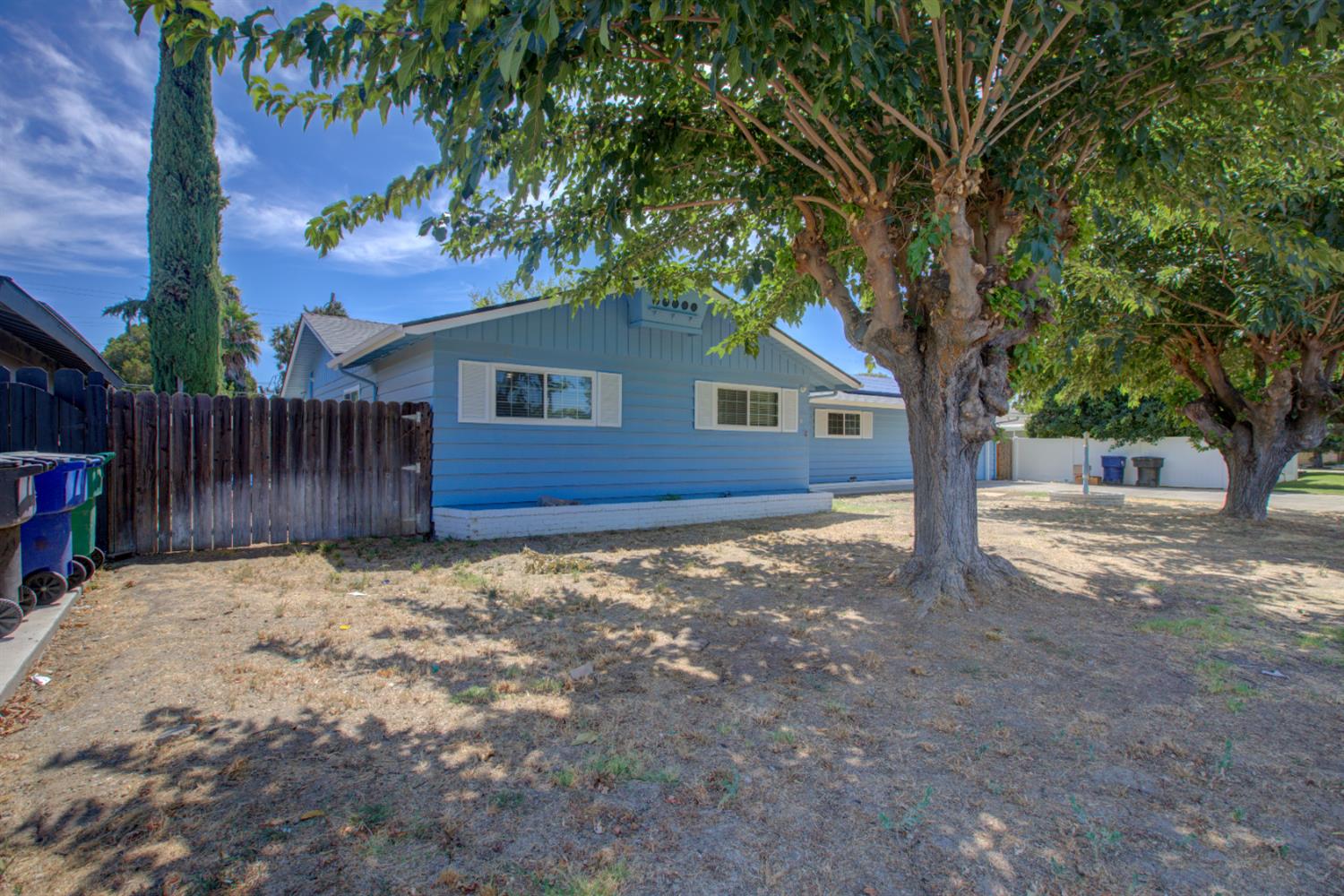 2982 Sequoia Drive Merced, CA 95340 - Photo 3 of 33 a house with tree in front of it