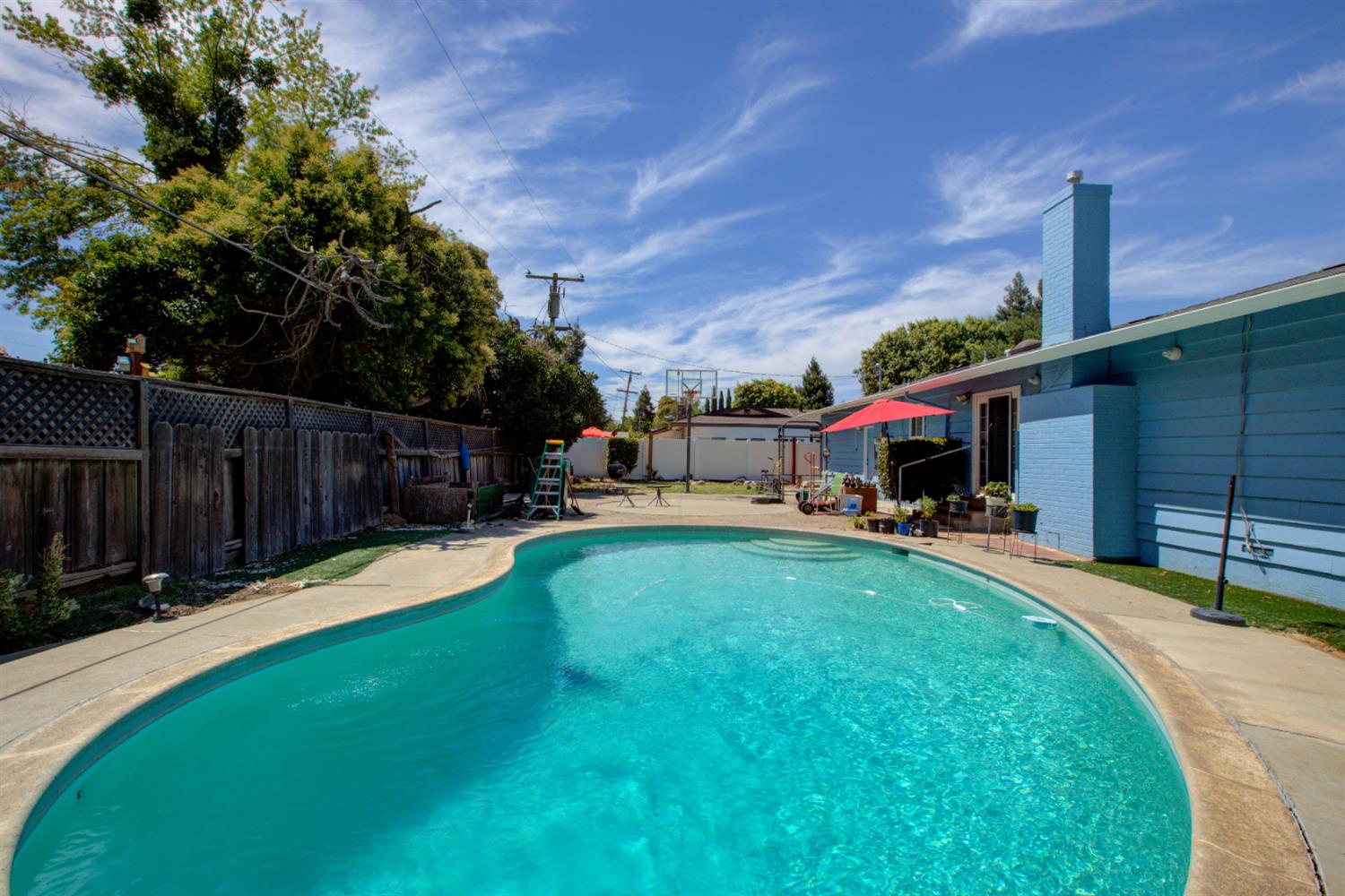 2982 Sequoia Drive Merced, CA 95340 - Photo 32 of 33 a view of a house with swimming pool and sitting area