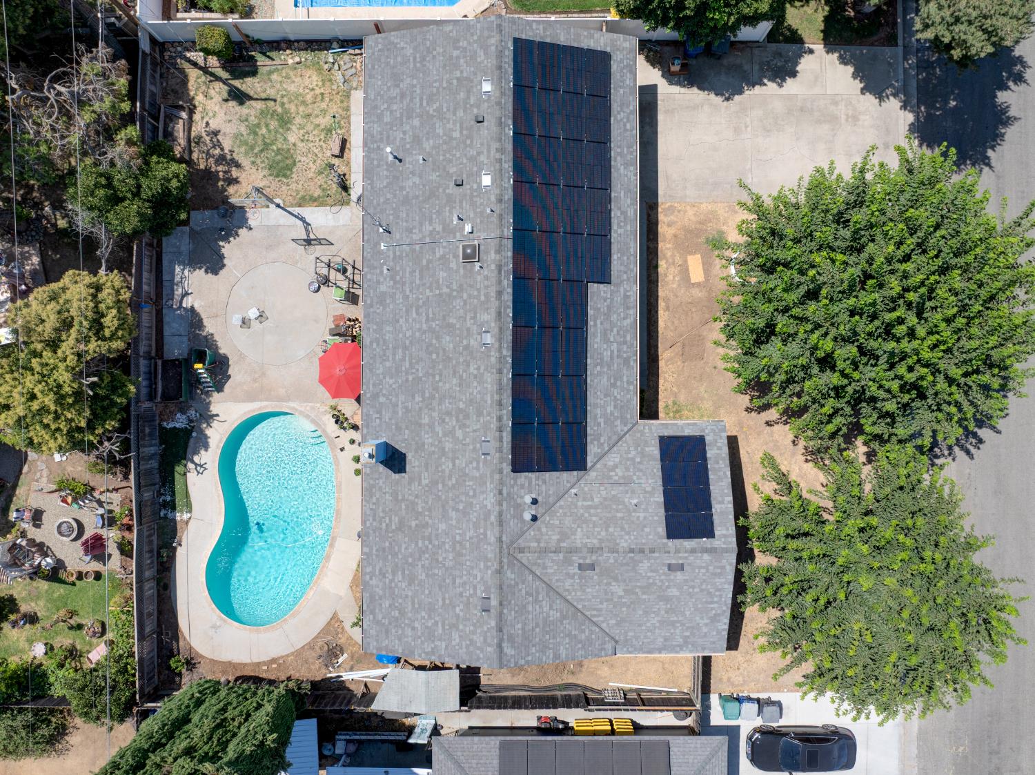 2982 Sequoia Drive Merced, CA 95340 - Photo 4 of 33 an aerial view of a house with swimming pool and large trees