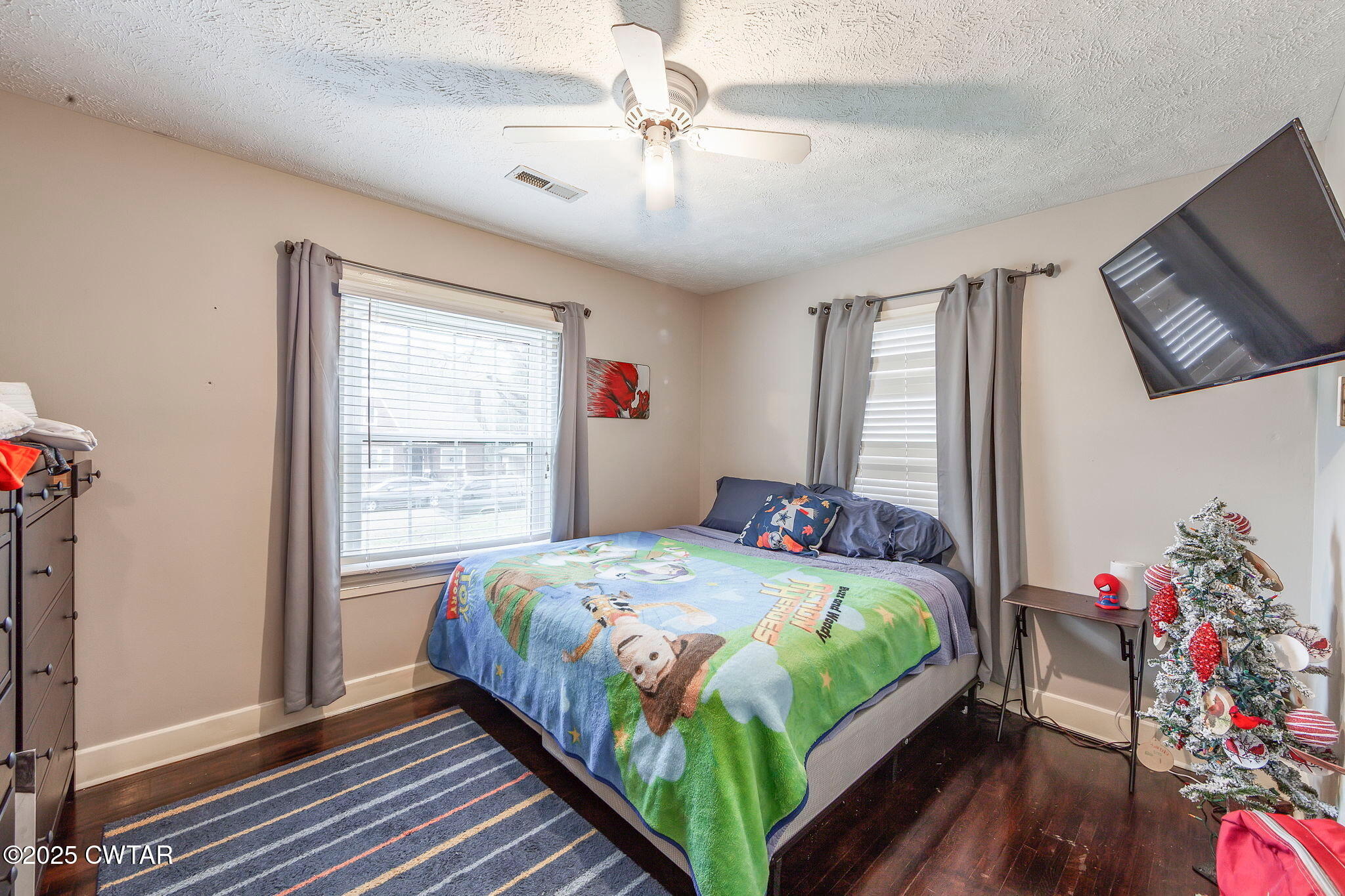 22 Sunset Avenue Jackson, TN 38301 - Photo 9 of 15 a bedroom with a bed and a chandelier