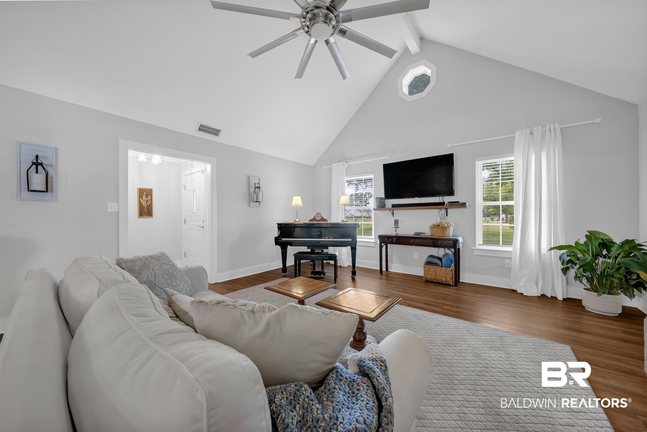 19090 Gunnison Road Fairhope, AL 36532 - Photo 5 of 42 Living area with high vaulted ceiling, wood finished floors, ceiling fan, and beamed ceiling