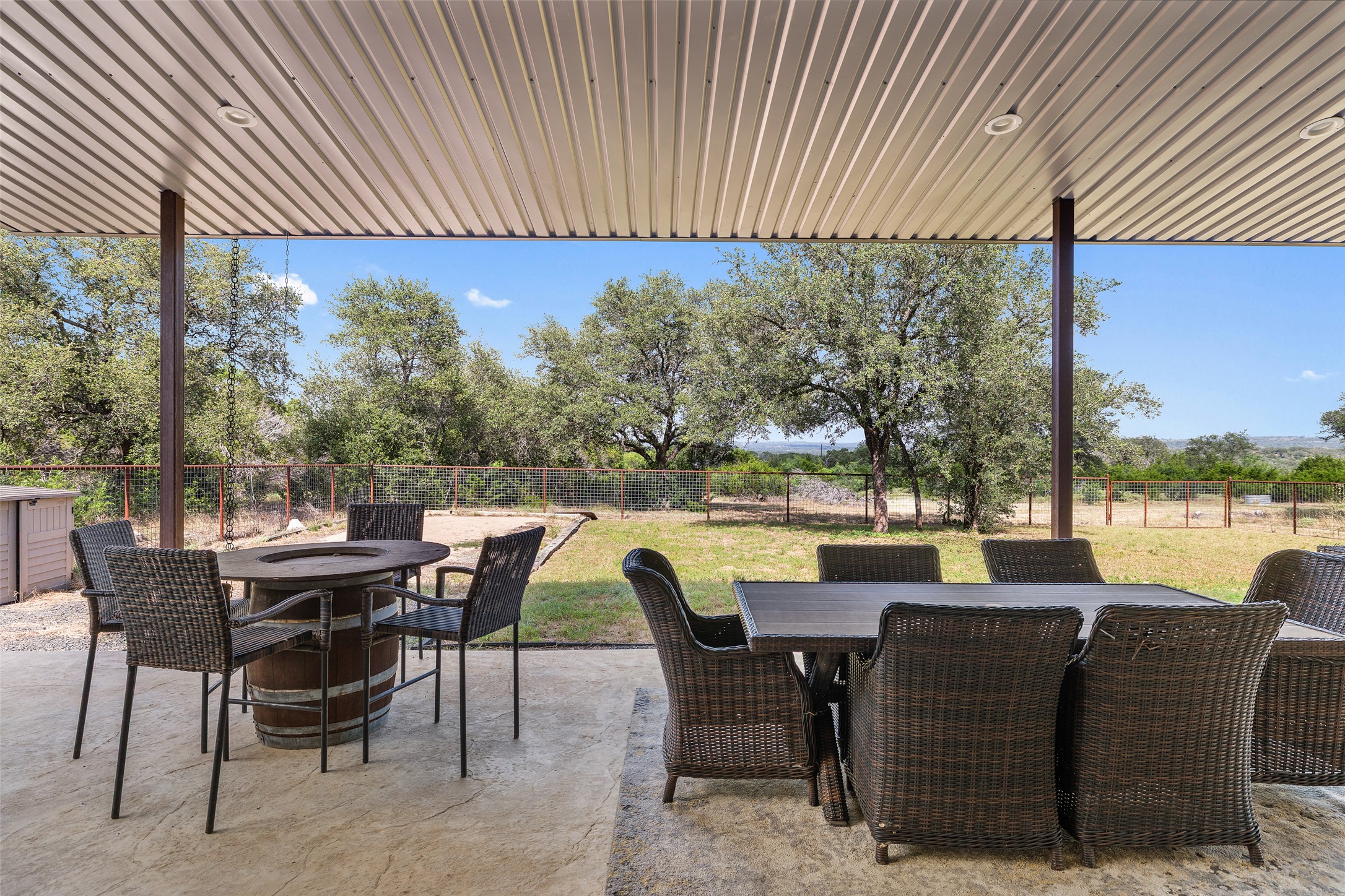 764 Stubbs Road Johnson City, TX 78636 - Photo 19 of 29 A spacious covered patio provides a delightful outdoor living space with scenic views of the surrounding landscape.