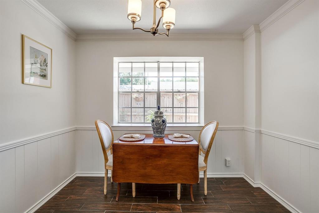 1147 Roaring Springs Road Fort Worth, TX 76114 - Photo 17 of 36 a view of a dining room with furniture window and wooden floor