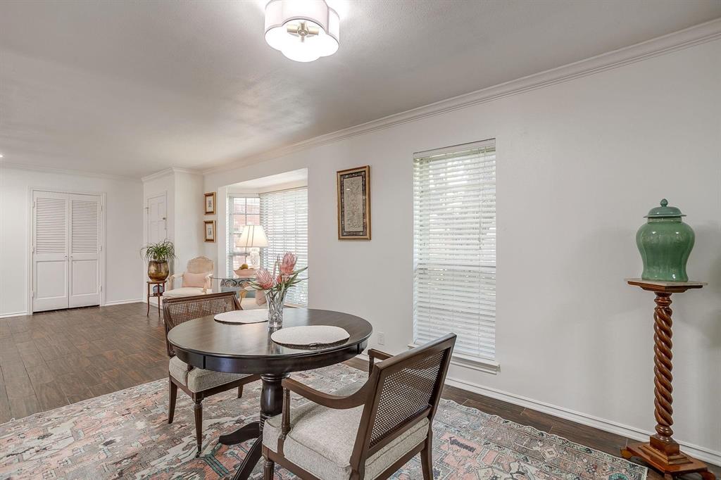 1147 Roaring Springs Road Fort Worth, TX 76114 - Photo 6 of 36 a view of a dining room with furniture and wooden floor