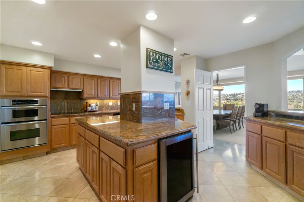 875 Comstock Avenue, Unit 16A Los Angeles, CA 90024 - Photo 14 of 28 a kitchen with stainless steel appliances granite countertop a sink stove and refrigerator