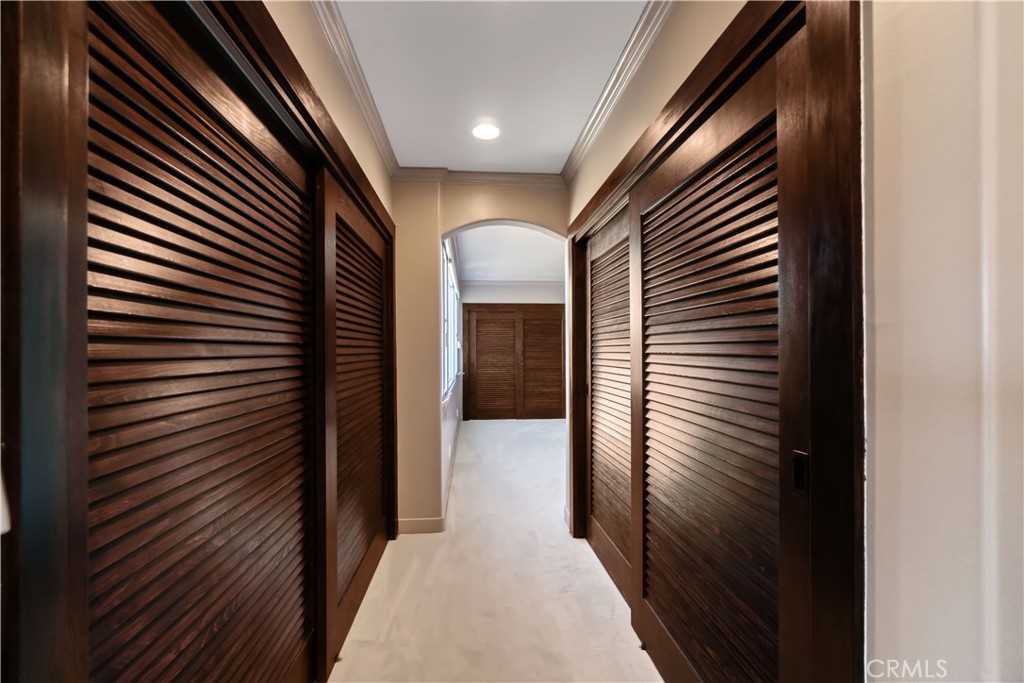 875 Comstock Avenue, Unit 16A Los Angeles, CA 90024 - Photo 15 of 28 a view of a hallway with wooden walls