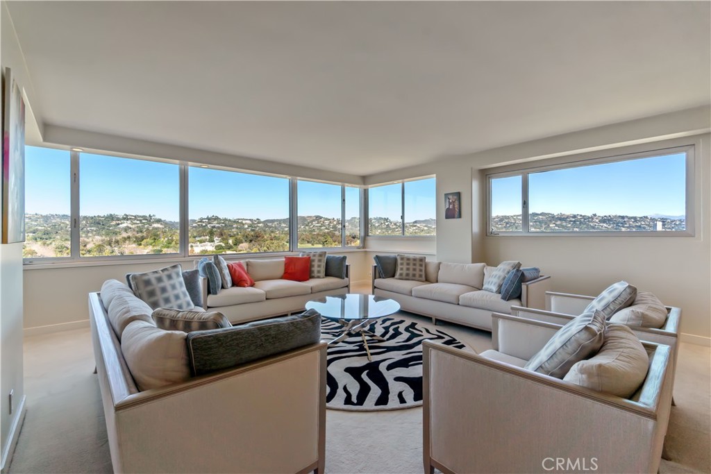 875 Comstock Avenue, Unit 16A Los Angeles, CA 90024 - Photo 3 of 28 a living room with furniture city view and large windows