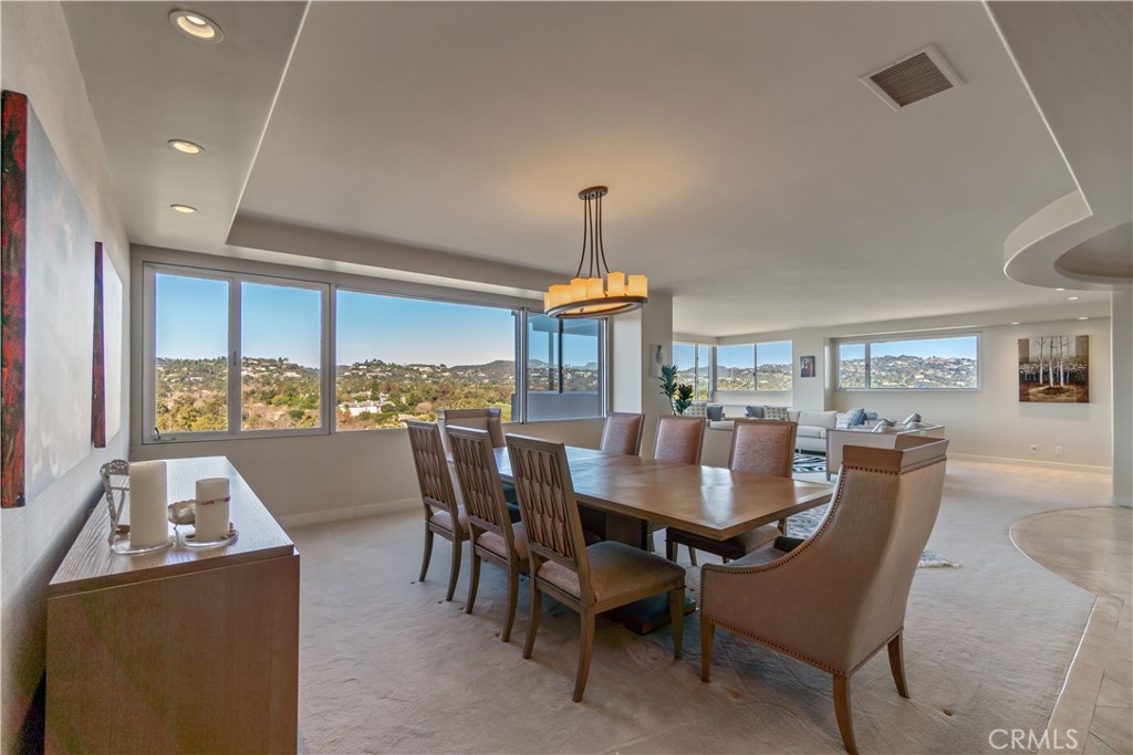 875 Comstock Avenue, Unit 16A Los Angeles, CA 90024 - Photo 8 of 28 a dining room with furniture a chandelier and wooden floor
