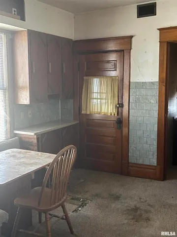 a kitchen with stainless steel appliances a stove a sink and a refrigerator