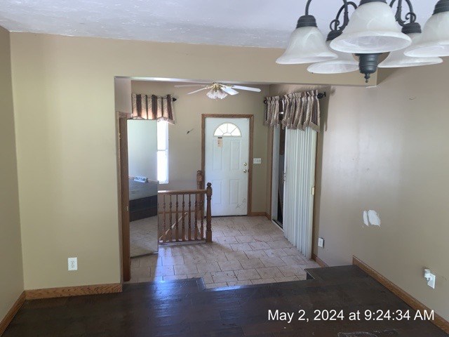 1722 Maple Road New Bethlehem, PA 16242 - Photo 4 of 19 a view of a hallway with wooden floor and chair