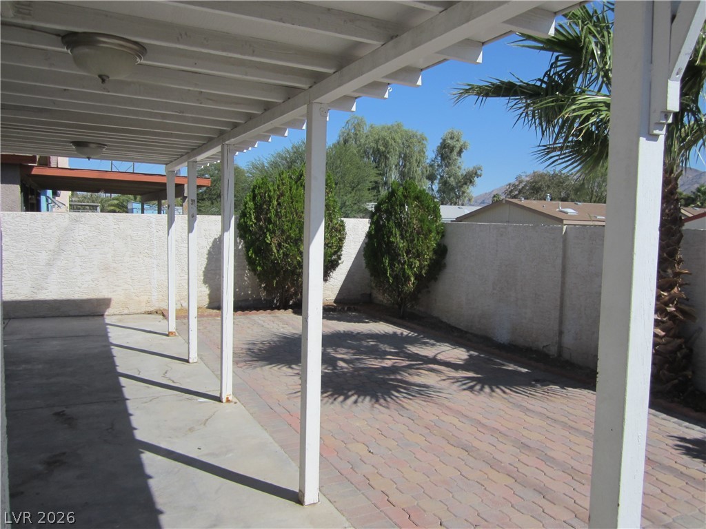 2882 Sandyfalls Way Las Vegas, NV 89142 - Photo 18 of 18 A spacious covered patio features sturdy pillars, providing an ideal setting for relaxation.