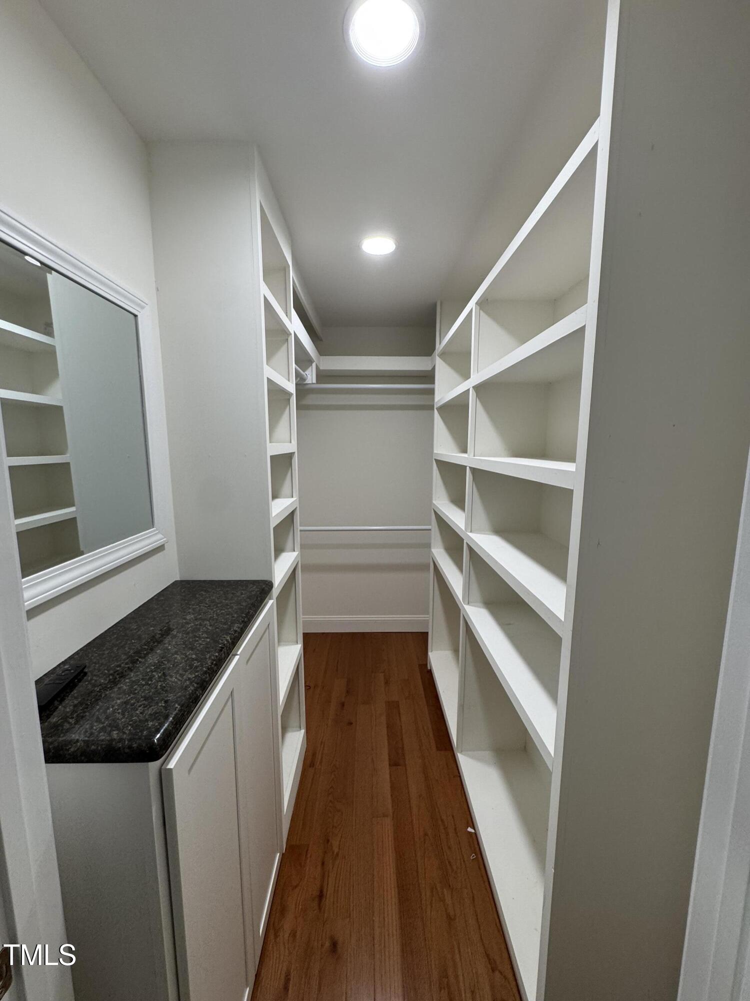 1513 Shelley Road Raleigh, NC 27612 - Photo 11 of 24 a walk in closet and wooden floor