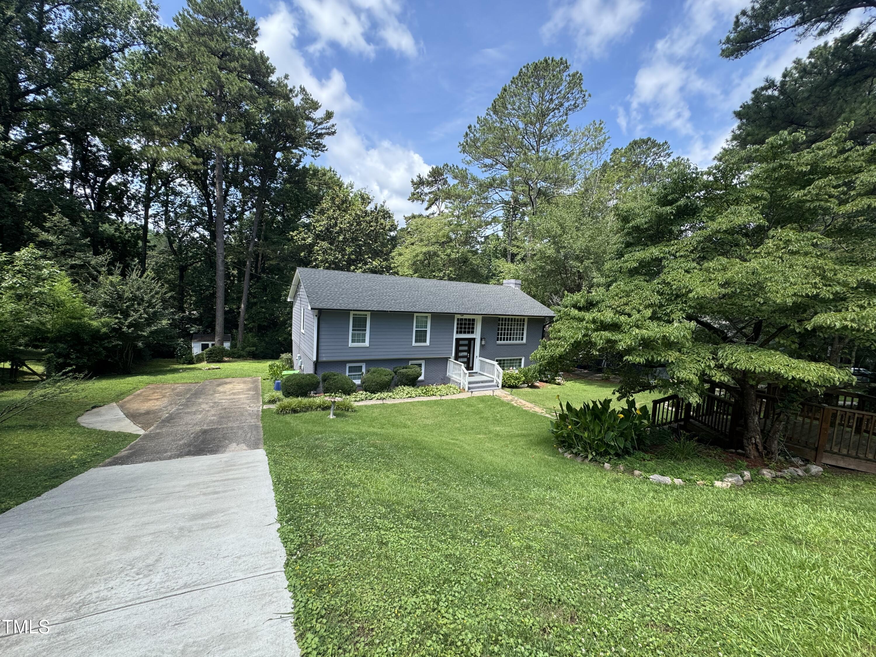 1513 Shelley Road Raleigh, NC 27612 - Photo 18 of 24 a front view of a house with garden