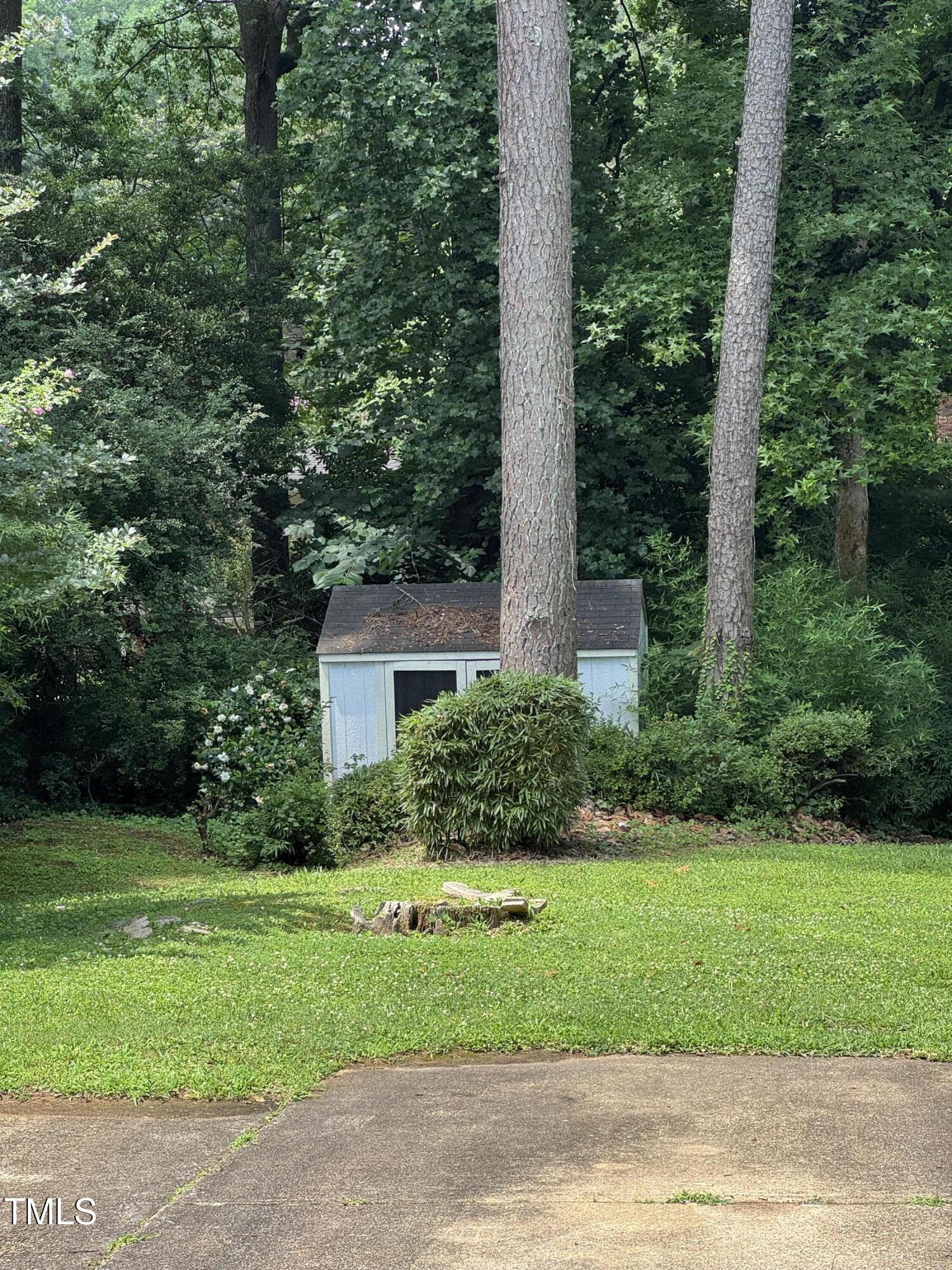 1513 Shelley Road Raleigh, NC 27612 - Photo 24 of 24 a front view of a house with a yard