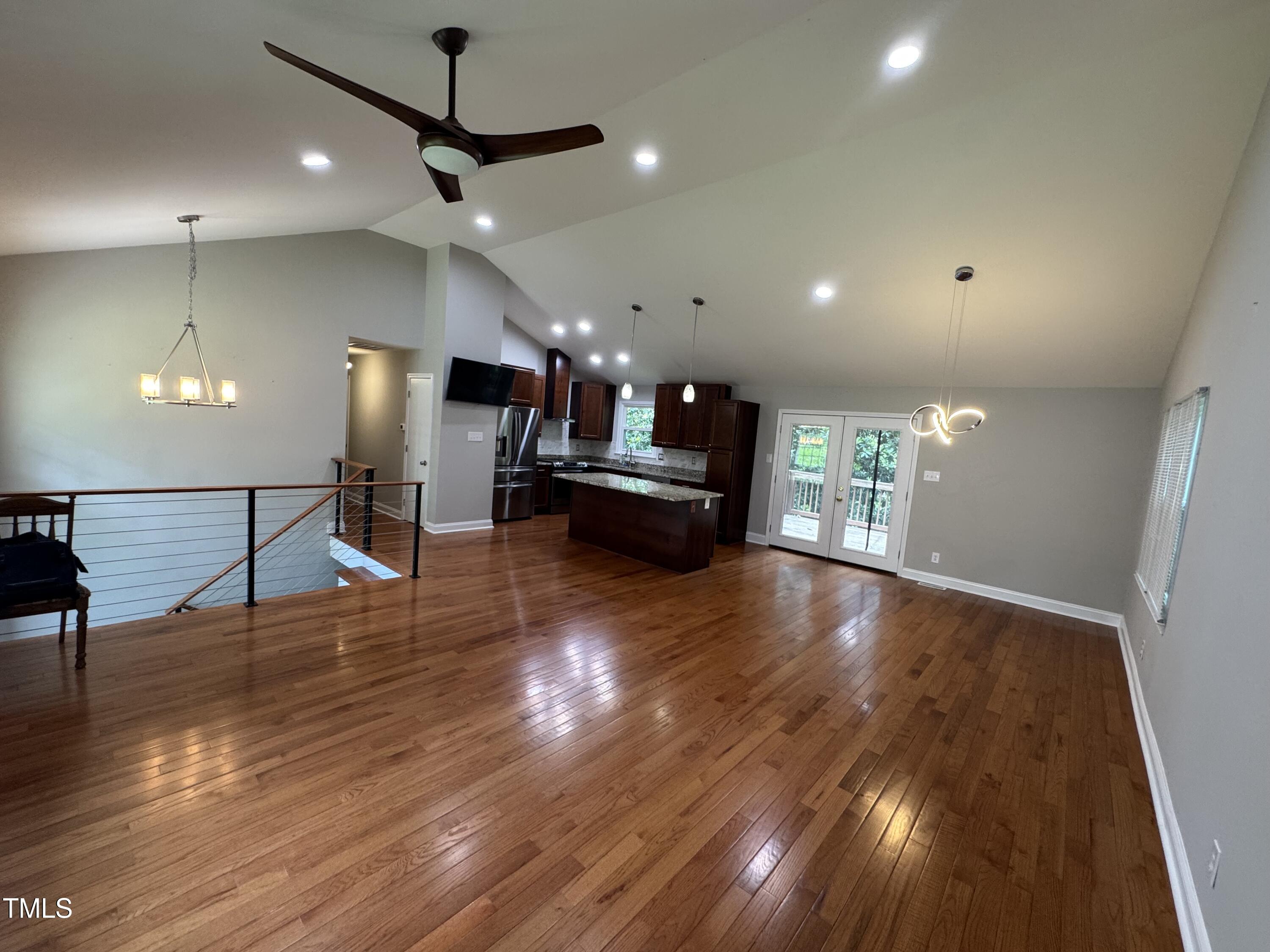1513 Shelley Road Raleigh, NC 27612 - Photo 4 of 24 a view of a room with gym equipment and windows