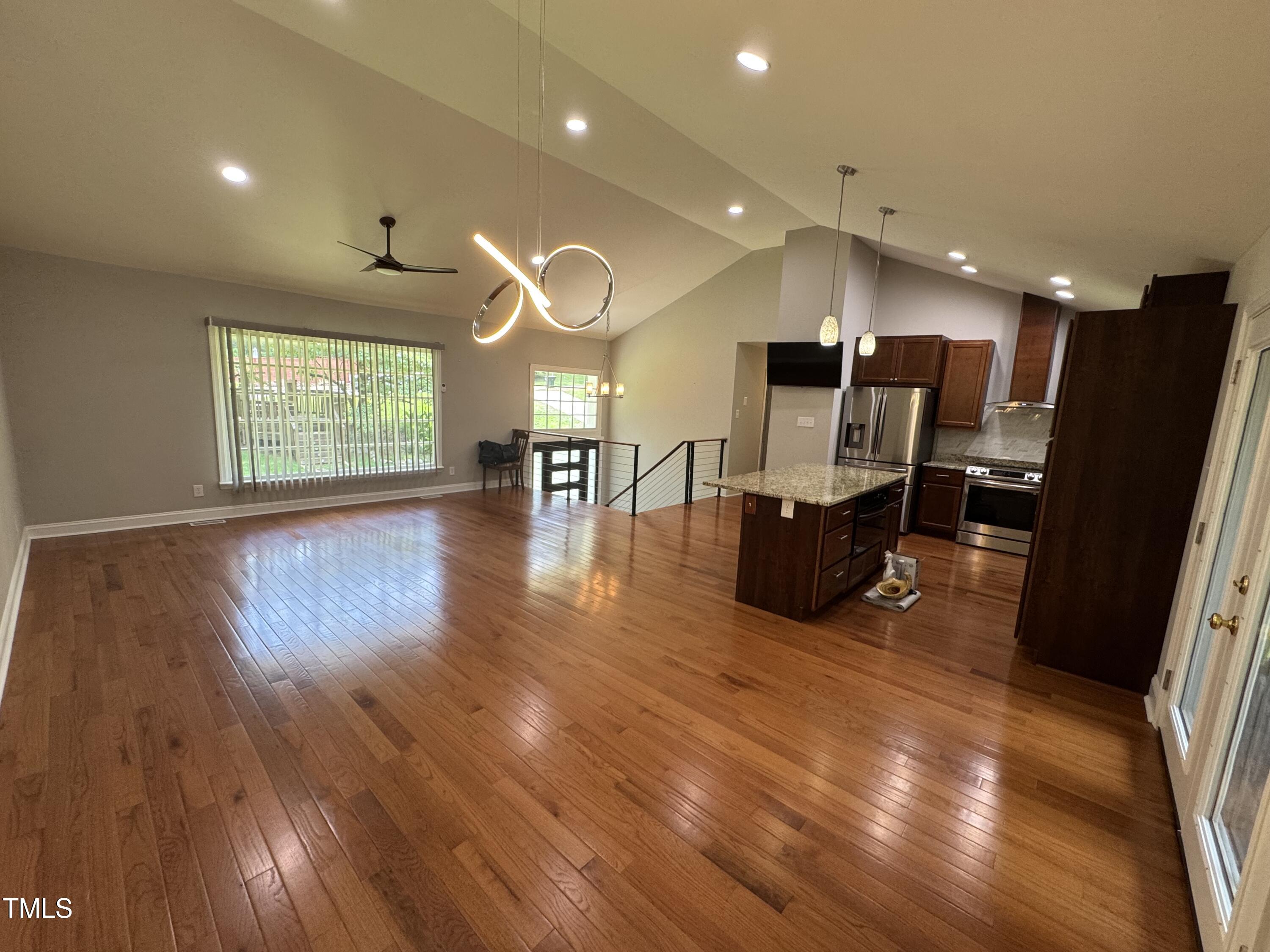 1513 Shelley Road Raleigh, NC 27612 - Photo 5 of 24 a living room with furniture and a wooden floor