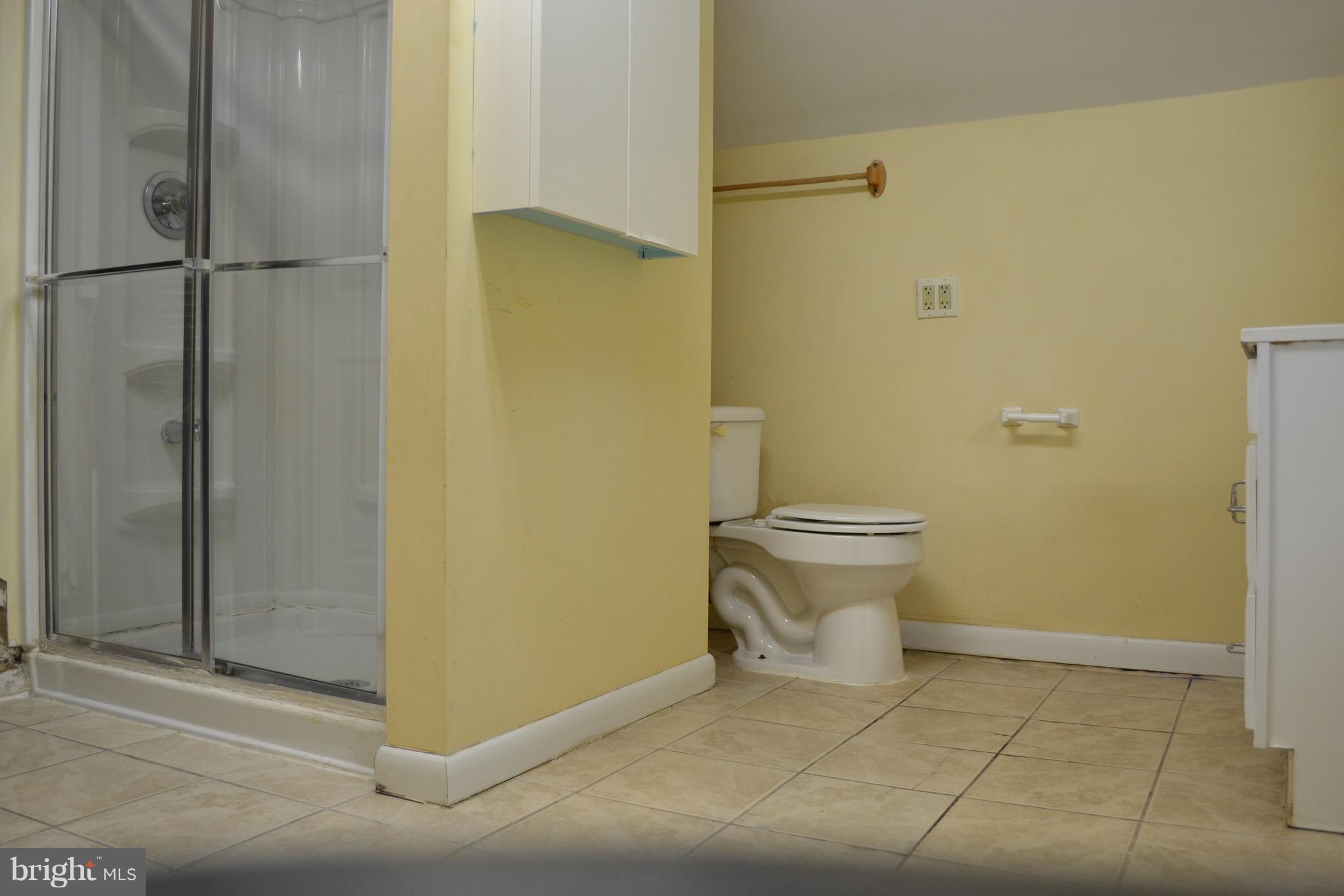 9300 Sanger Street Lorton, VA 22079 - Photo 13 of 16 a bathroom with a toilet and a shower