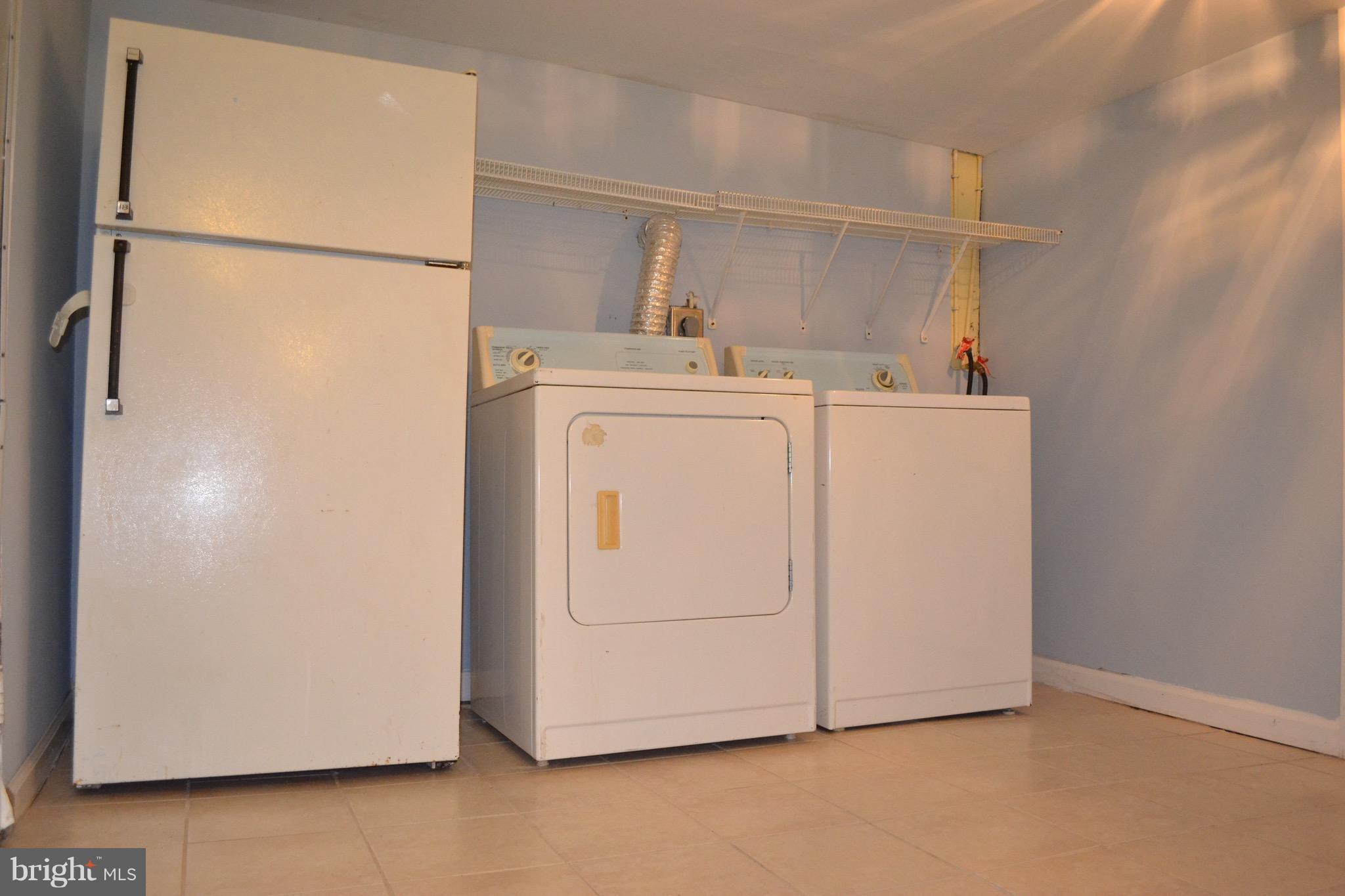 9300 Sanger Street Lorton, VA 22079 - Photo 15 of 16 a utility room with dryer and washer