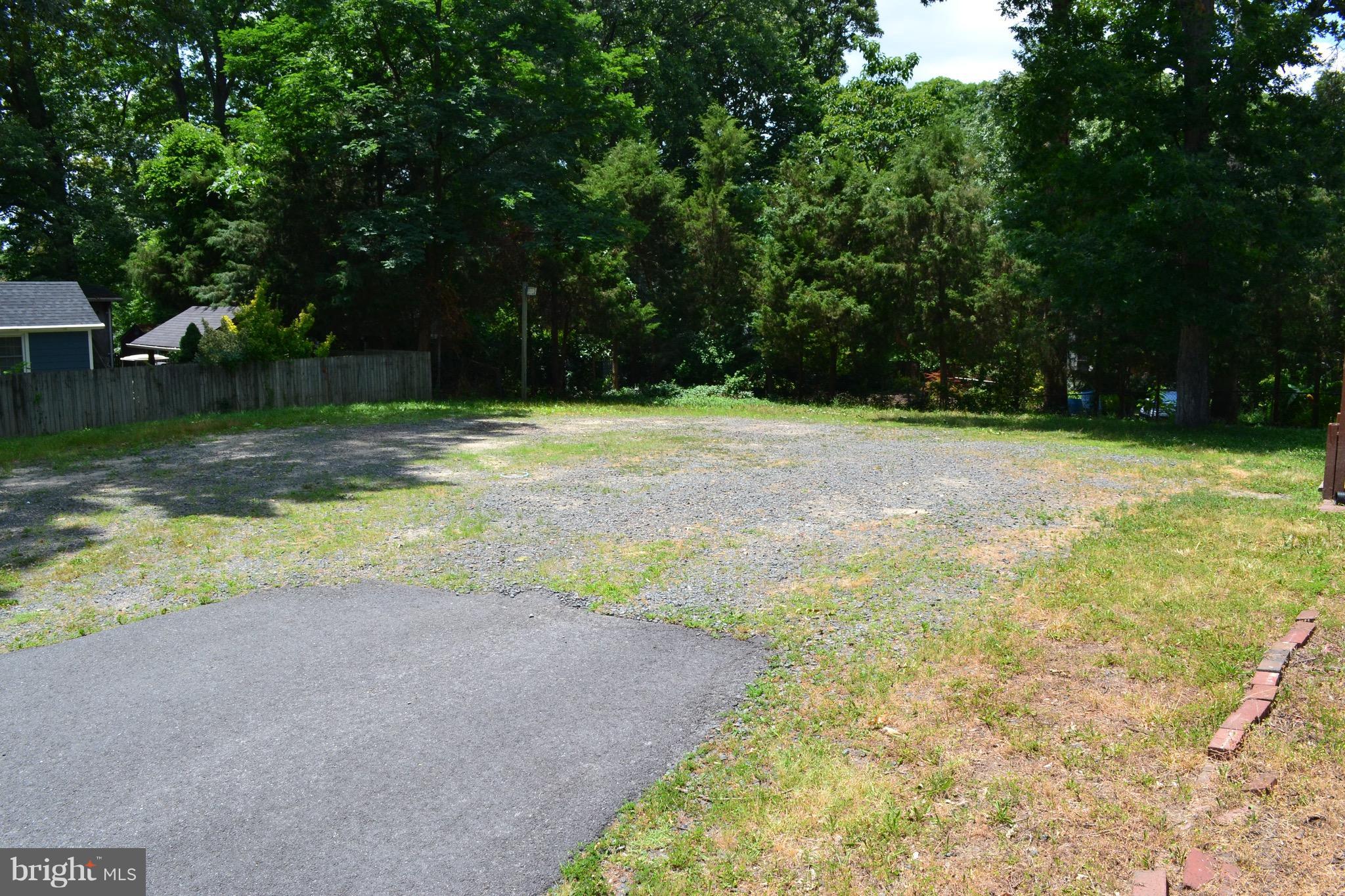 9300 Sanger Street Lorton, VA 22079 - Photo 3 of 16 a view of a yard with a trees