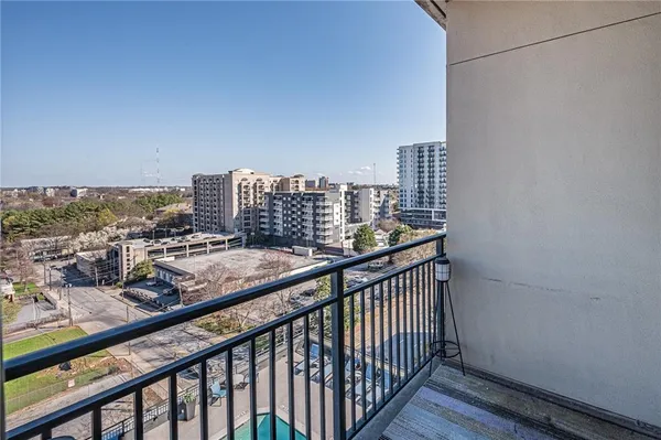 a view of a balcony with city