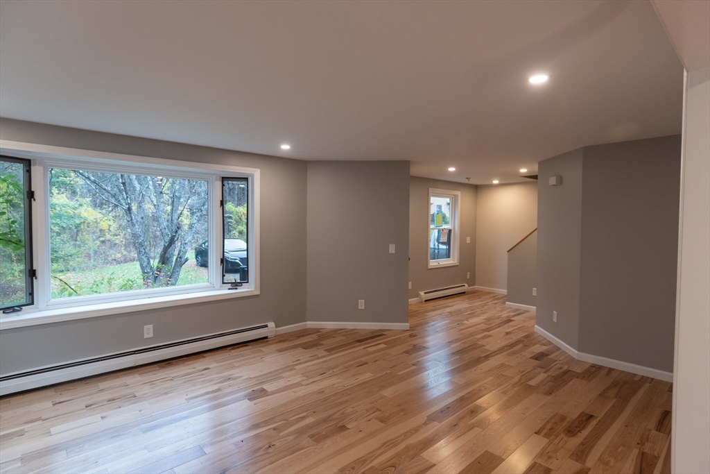 2 Mountain Rd Estates, Unit C Gill, MA 01354 - Photo 2 of 17 a view of livingroom with furniture wooden floor and window
