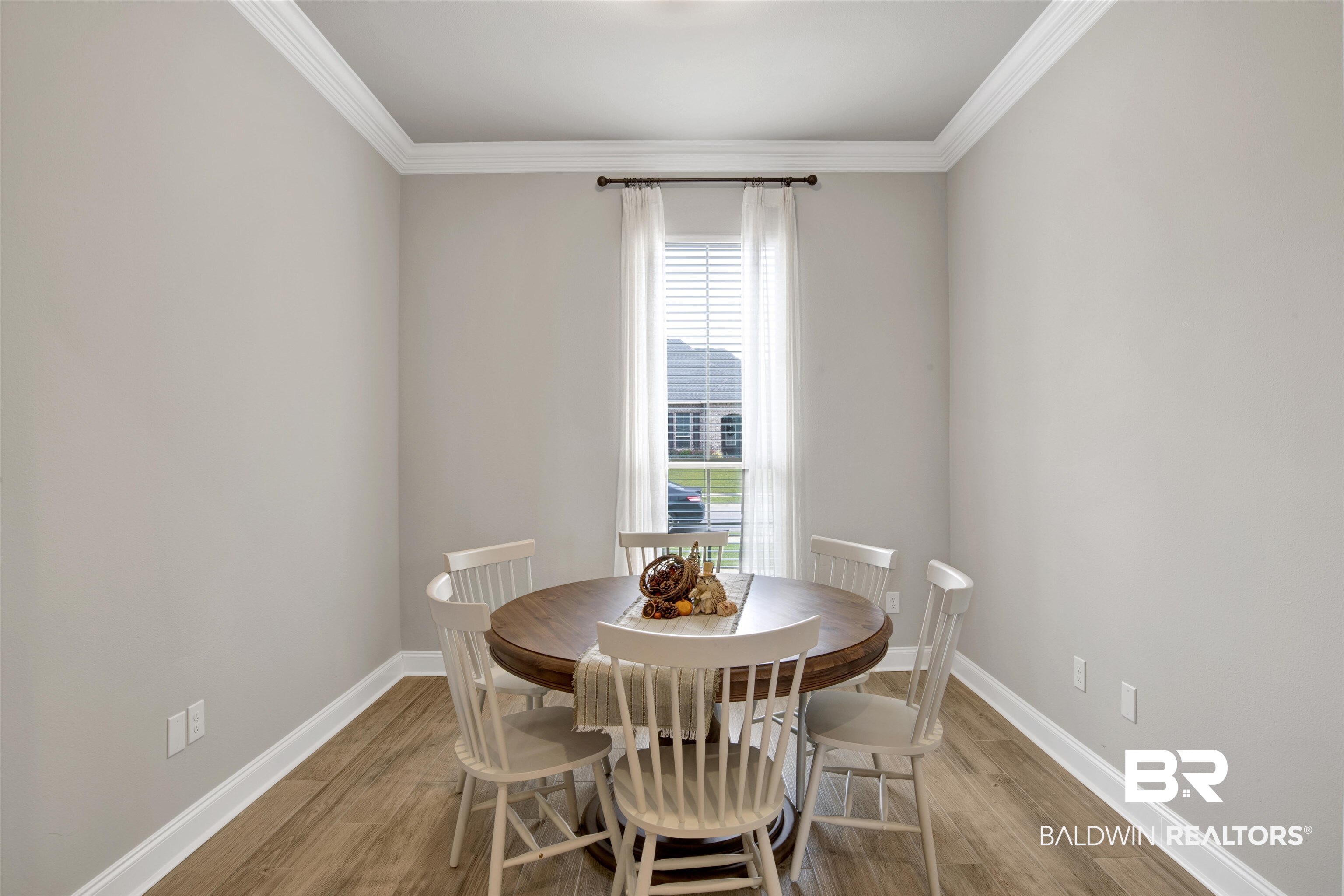 30770 Marcel Boulevard Spanish Fort, AL 36527 - Photo 6 of 23 Dining space with crown molding and light hardwood / wood-style floors