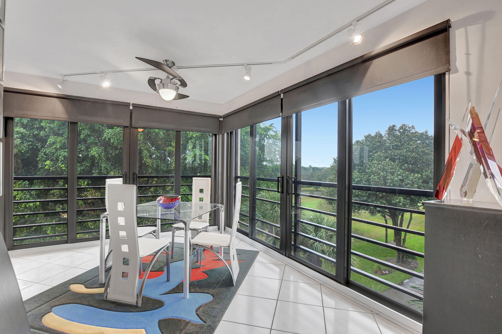 7572 Regency Lake Drive, Unit 502 Boca Raton, FL 33433 - Photo 17 of 54 Impact glass enclosed patio