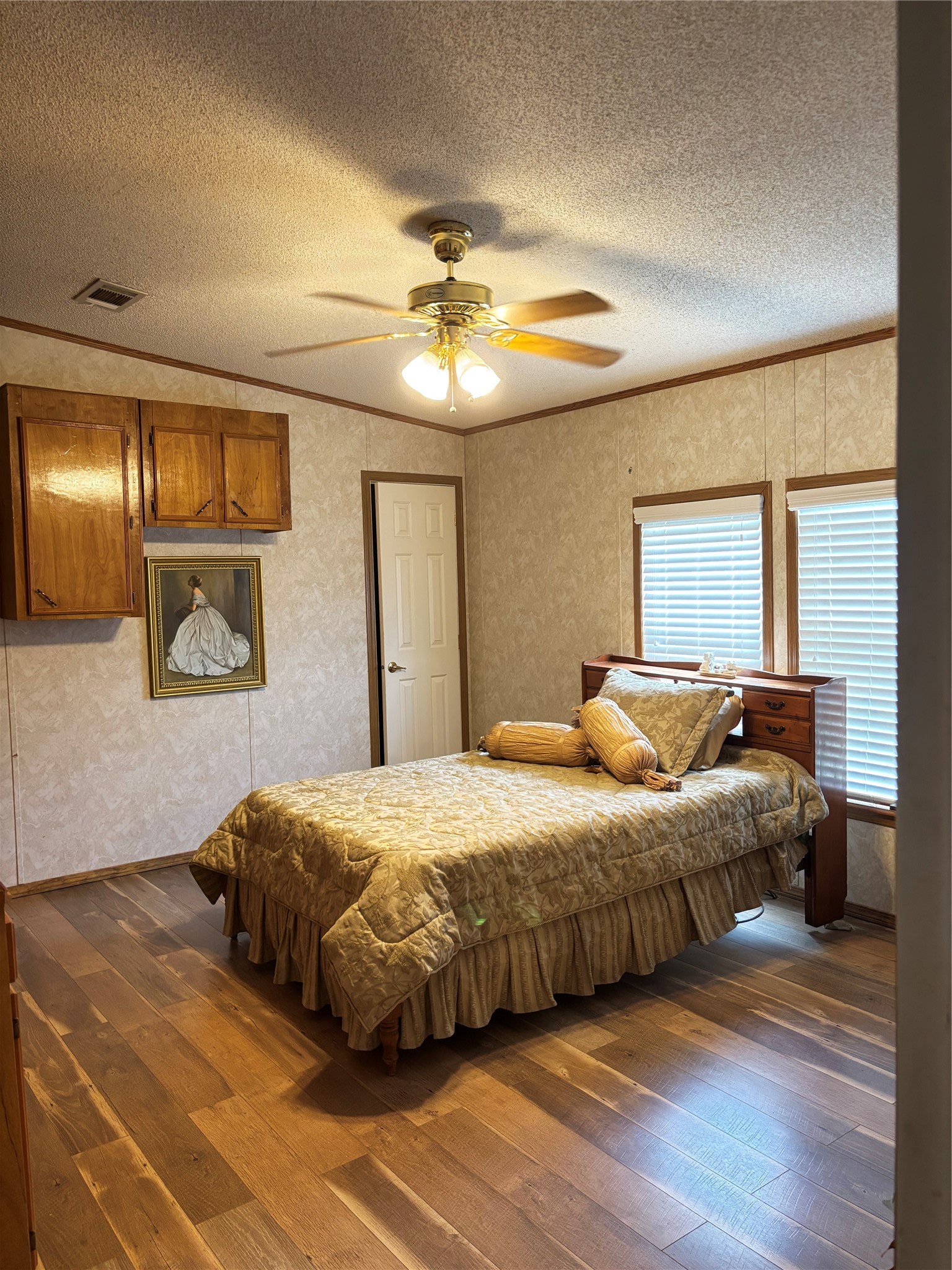 35599 State Highway South Buna, TX 77612 - Photo 37 of 40 a bedroom with a bed and a chandelier