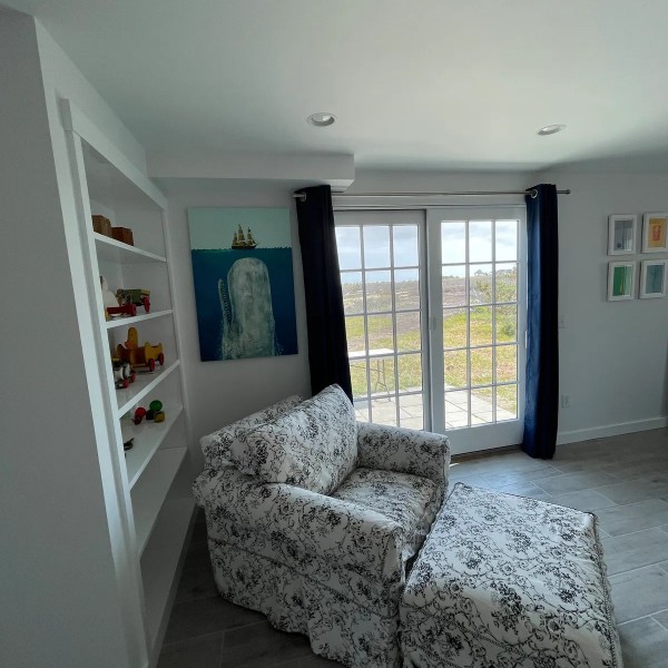 22 Sheep Pond Road Nantucket, MA 02554 - Photo 26 of 27 a living room with furniture and a large window